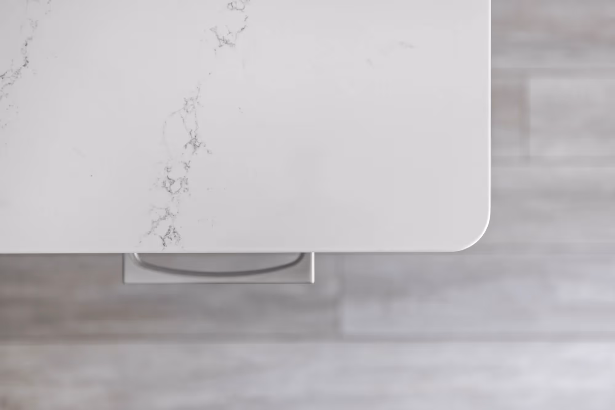 Close-up of white marble countertop with subtle veining