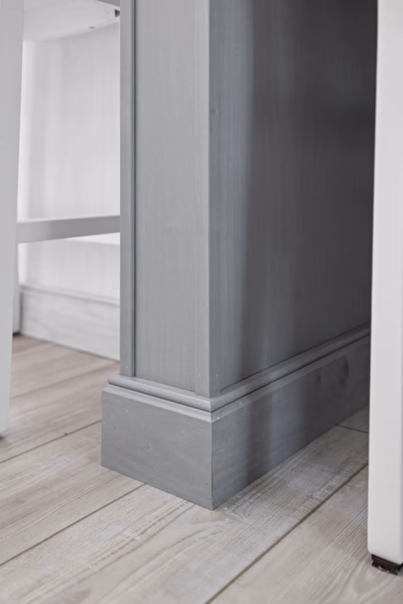 Minimalist kitchen with tall pantry cabinets and sleek finishes.