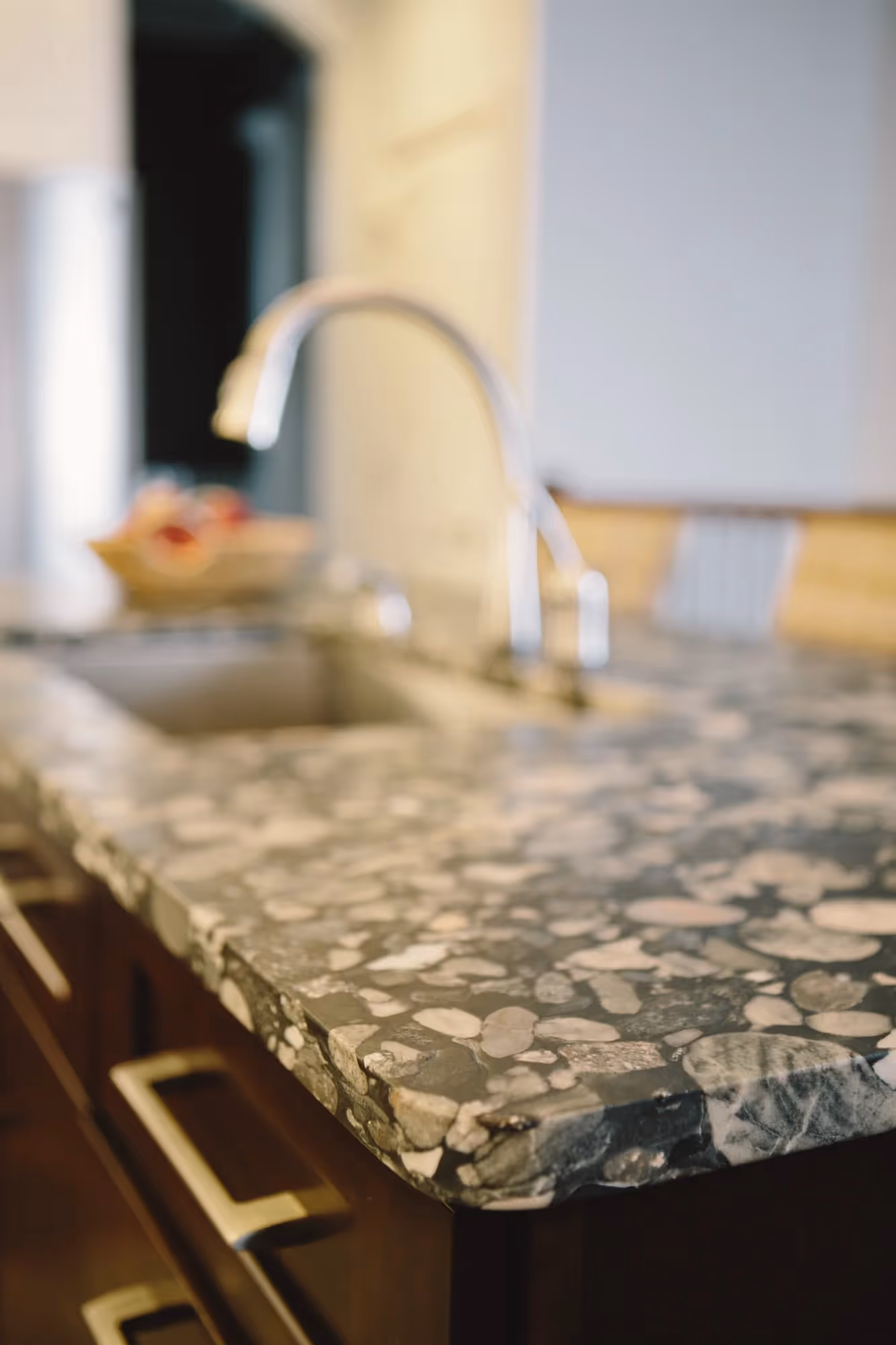 Close-up of wine glasses on a kitchen counter