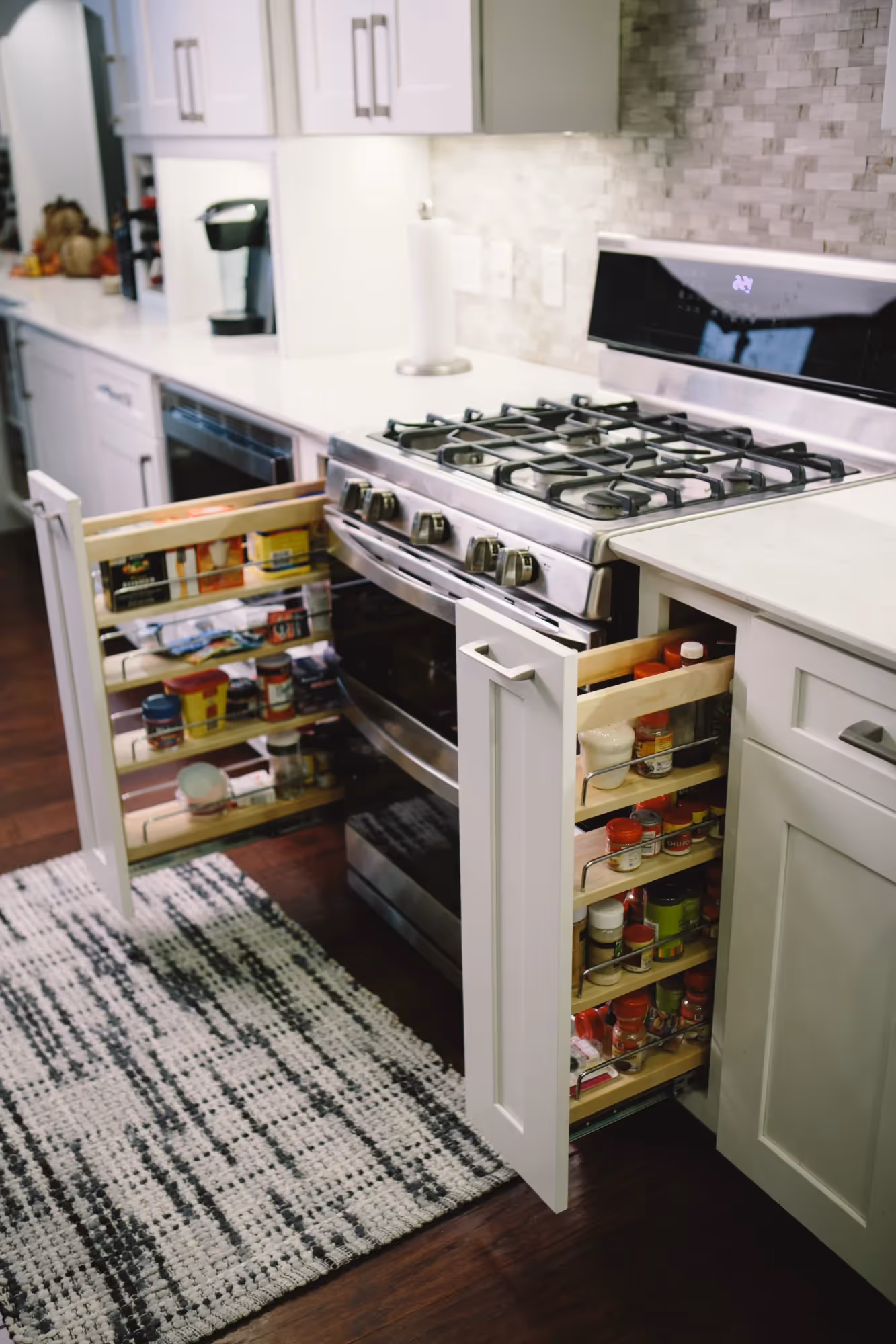 Kitchen drawer with organized spice jars.