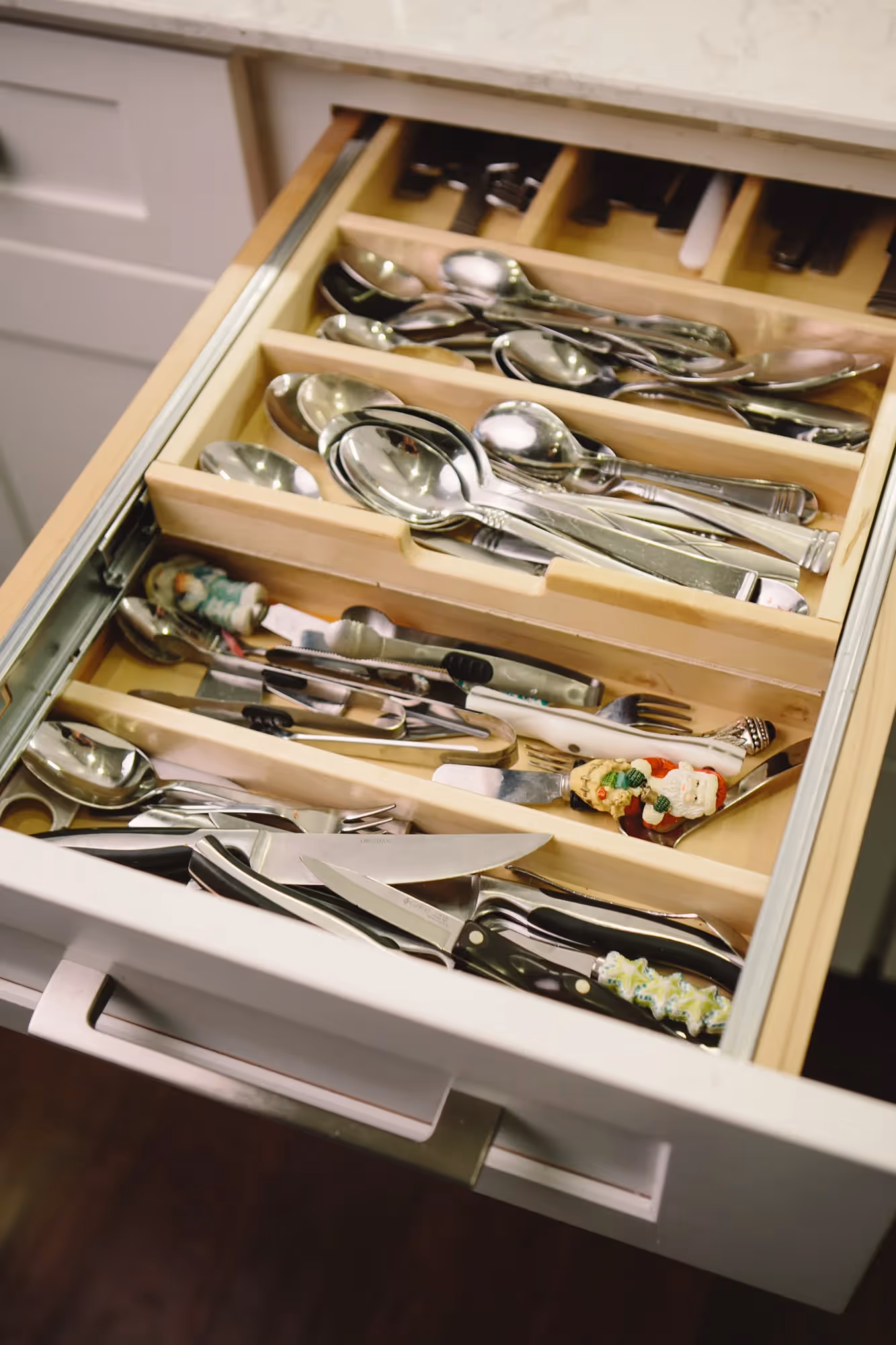 Open kitchen drawer with neatly arranged utensils