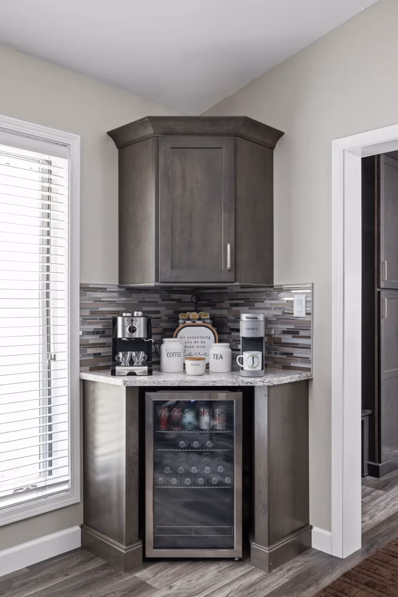 Kitchen corner with pantry door and window