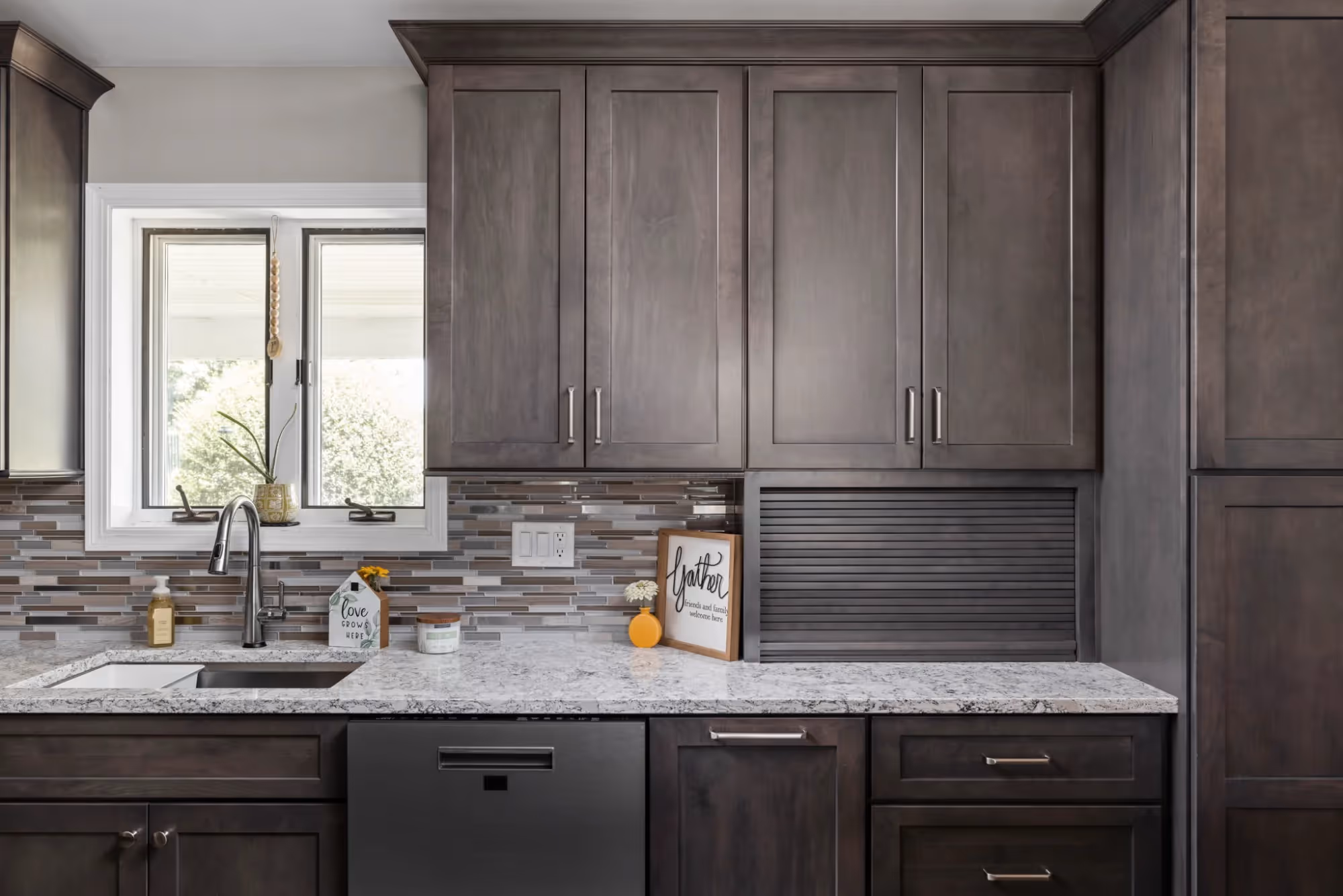 Dark wood kitchen cabinetry with under-cabinet lighting