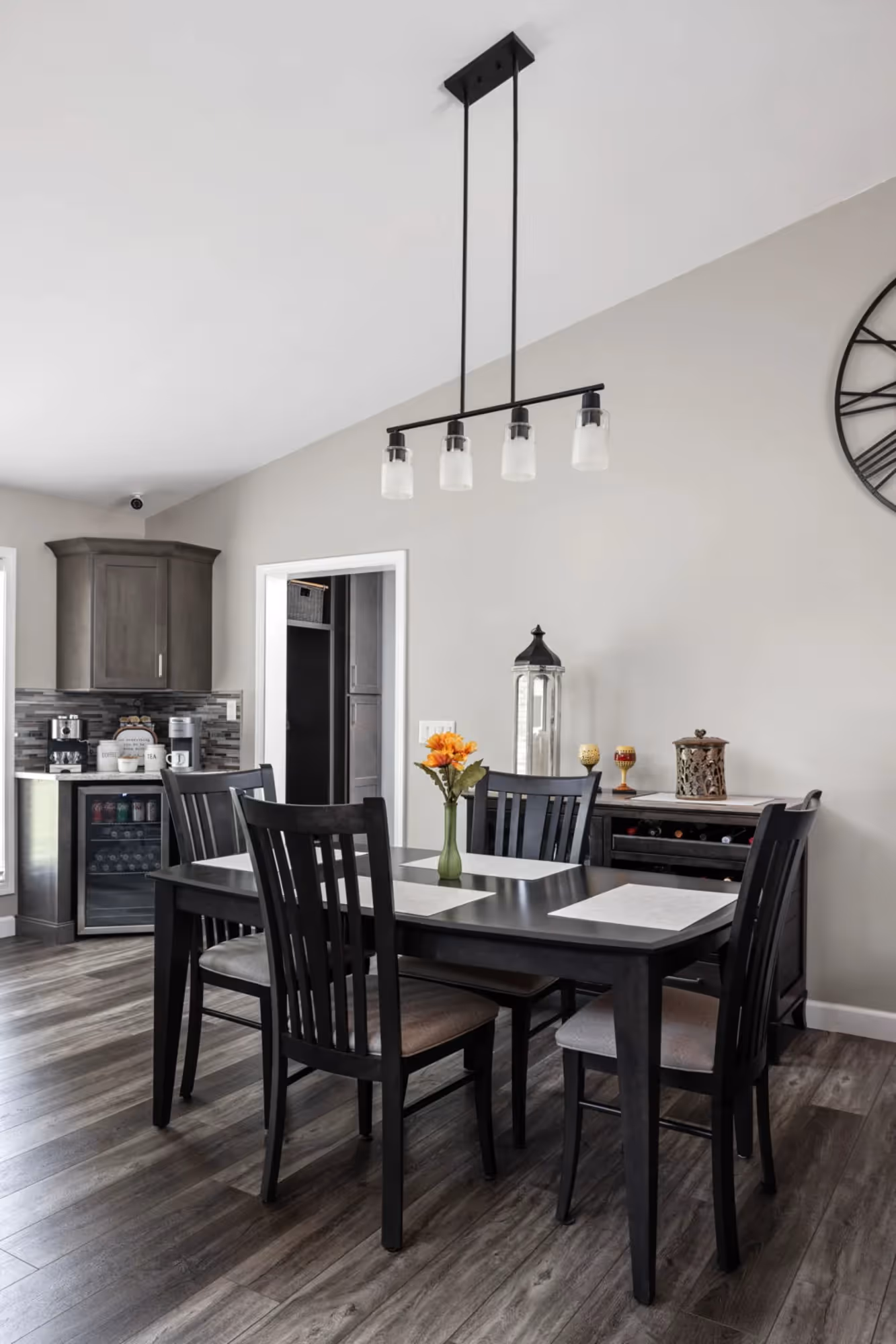 Modern dining area with wooden table and black chairs