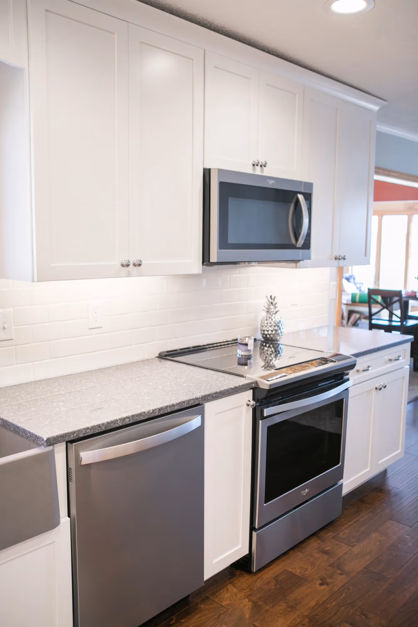 Kitchen corner with sink, dishwasher, and microwave