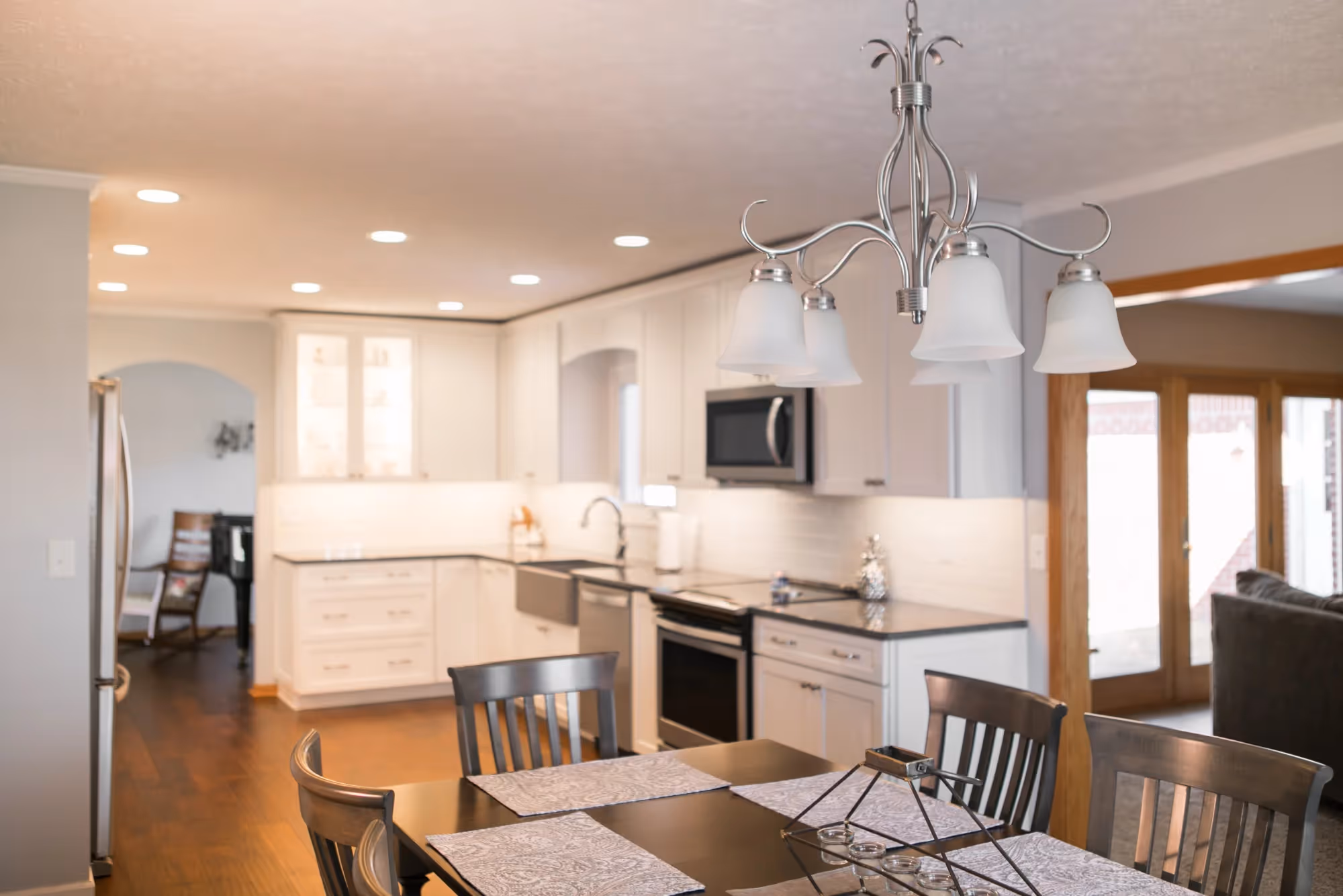 Bright kitchen and dining area with island and pendant lights