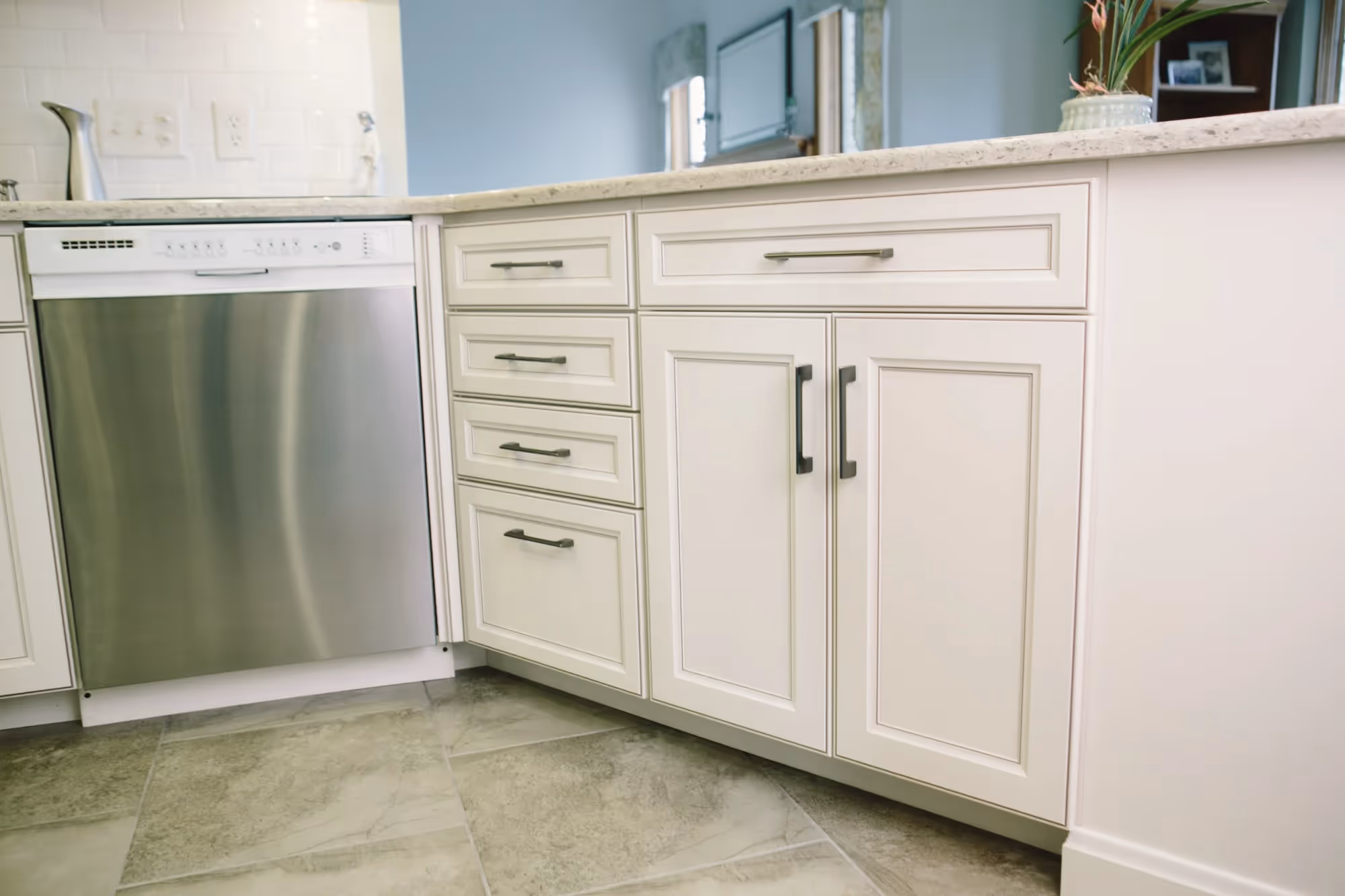 Kitchen with white cabinets and countertop.