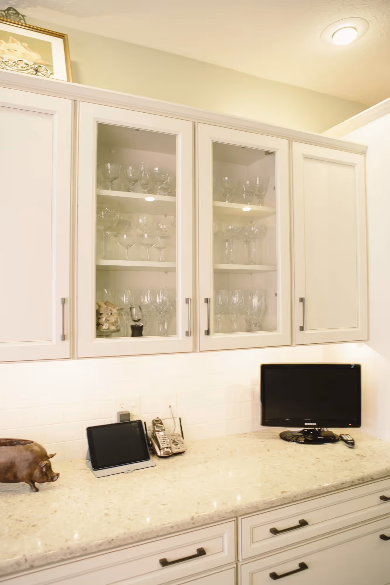 White kitchen counter with sink and small appliances
