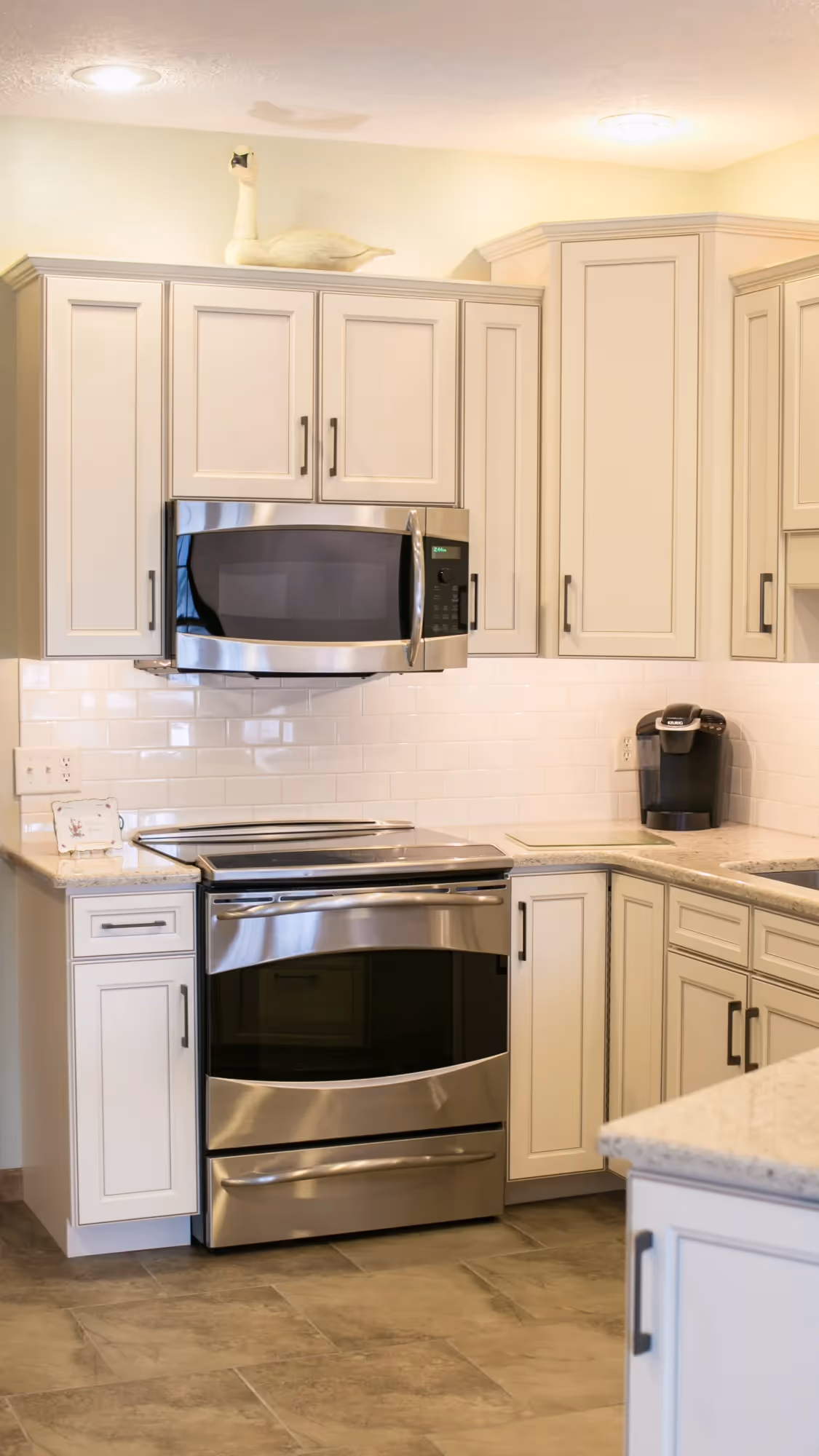 Modern kitchen with stainless steel range and microwave