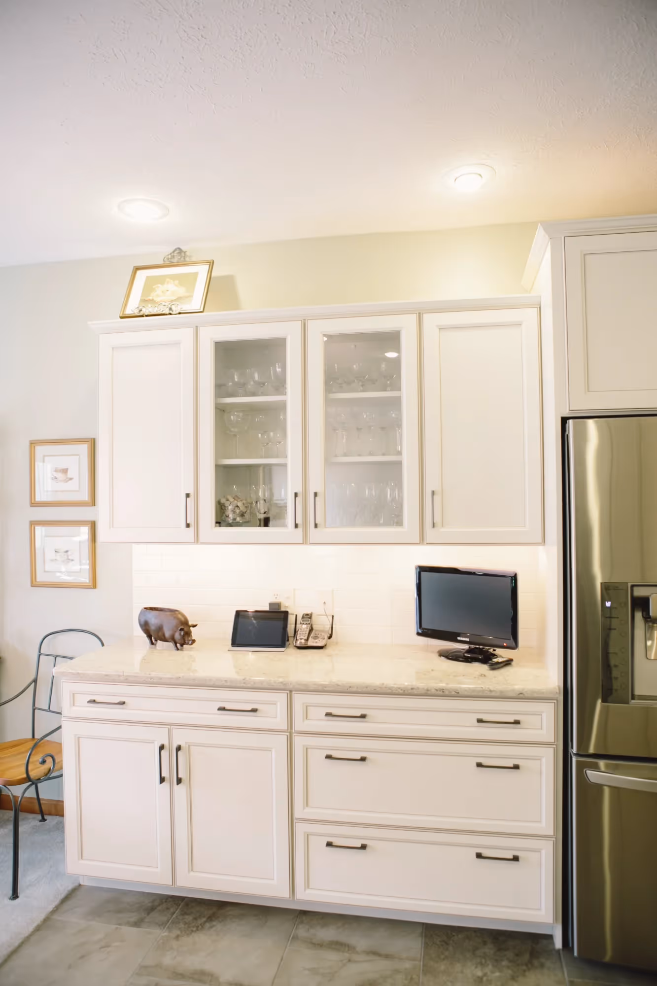 Bathroom with white cabinetry and a glass shower enclosure.