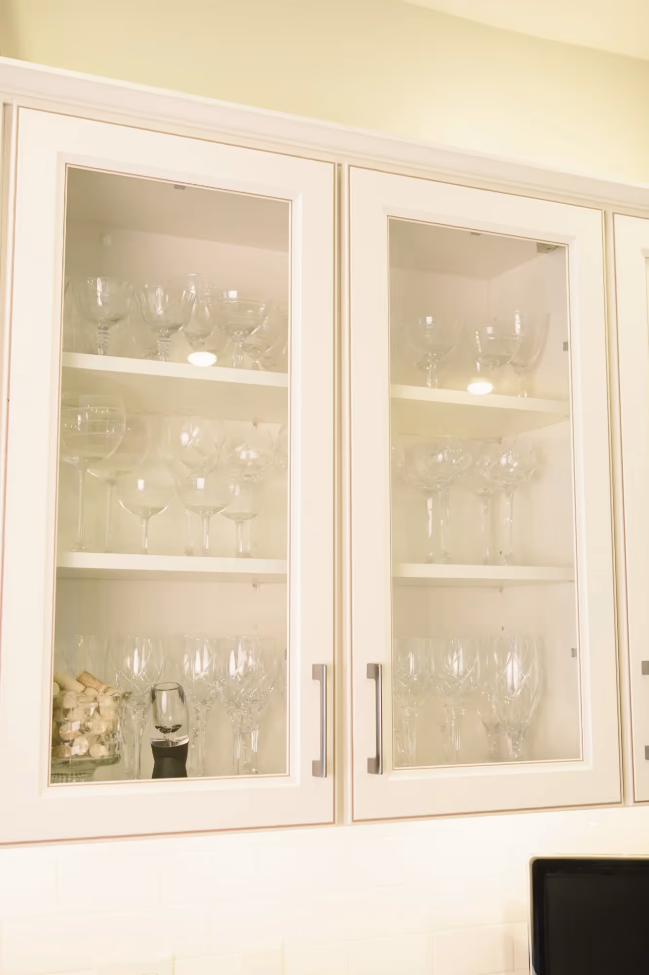 Glass in the white wood cabinet