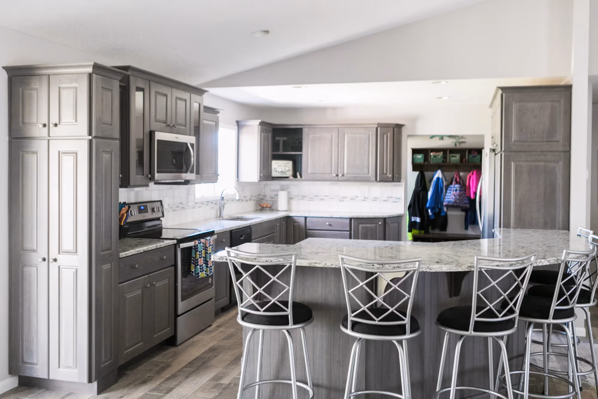 Modern kitchen with a large island and bar stools.