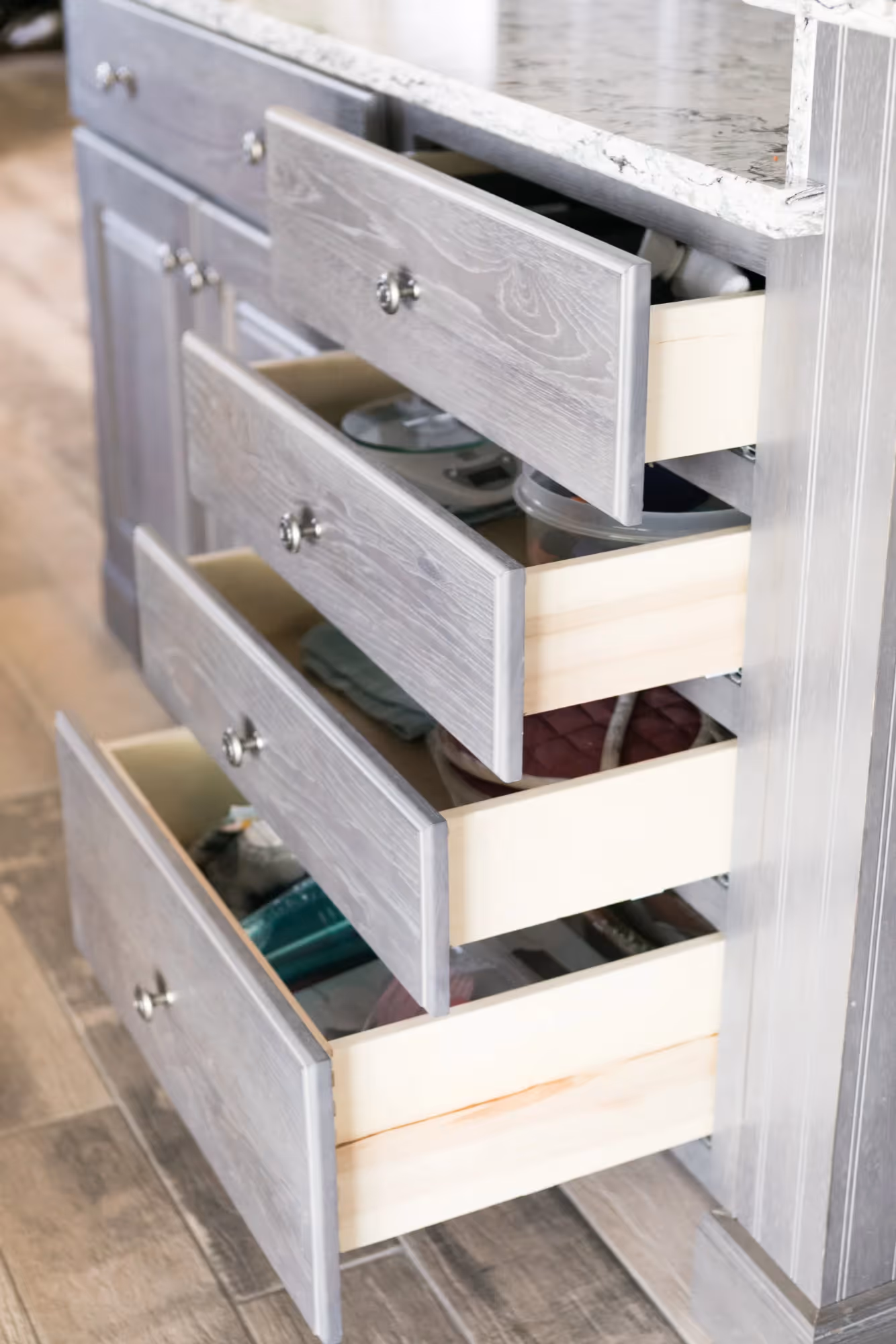 Open kitchen drawers showing organized storage space.