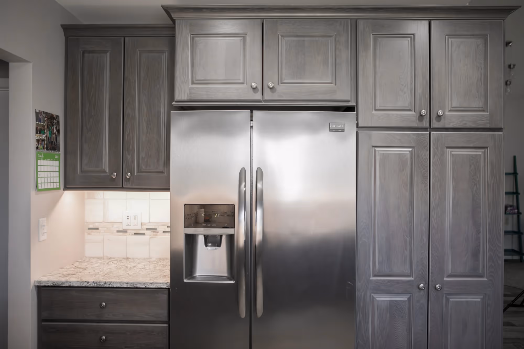 Modern kitchen with gray cabinets and stainless steel appliances