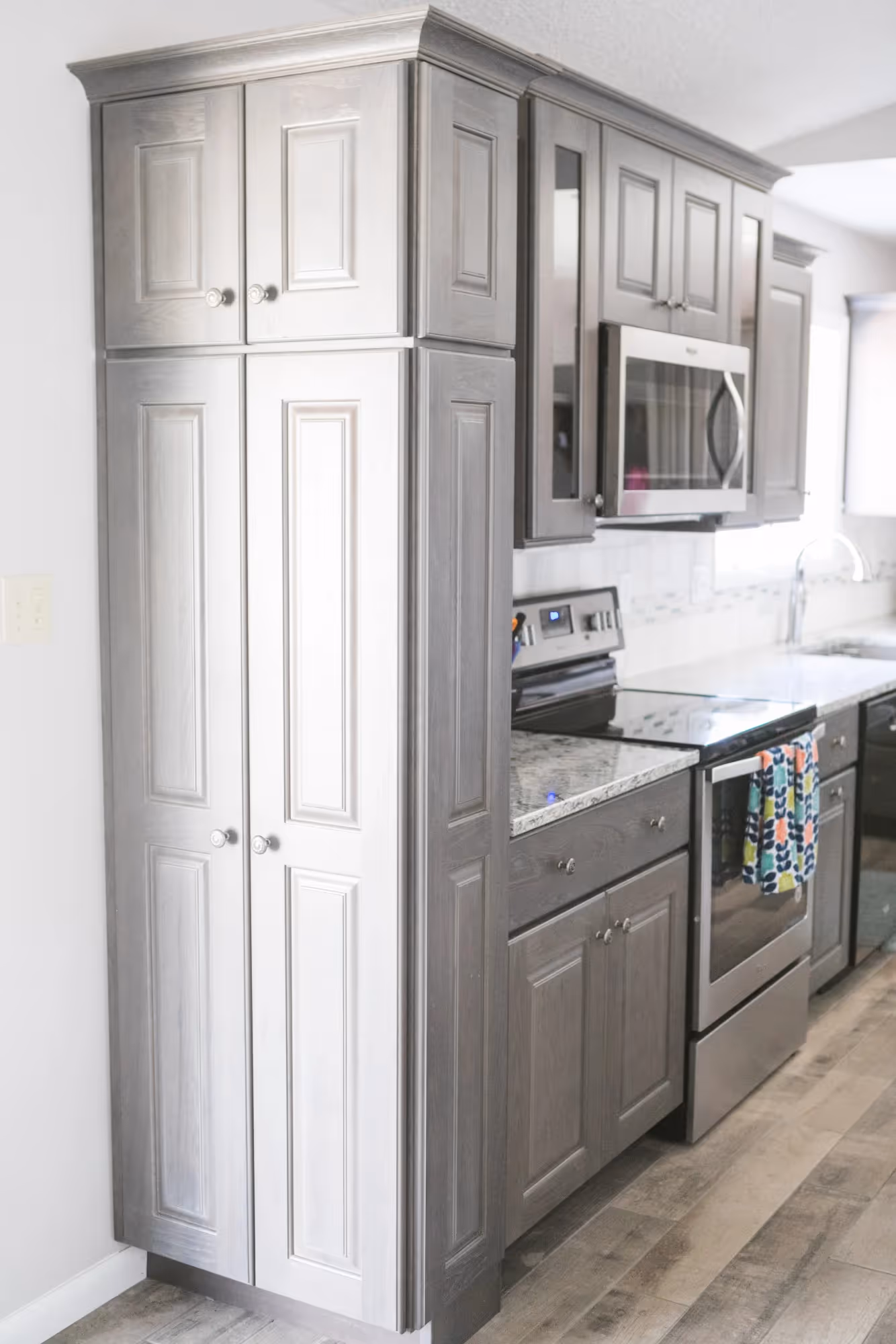 Compact white kitchen with sleek cabinetry.