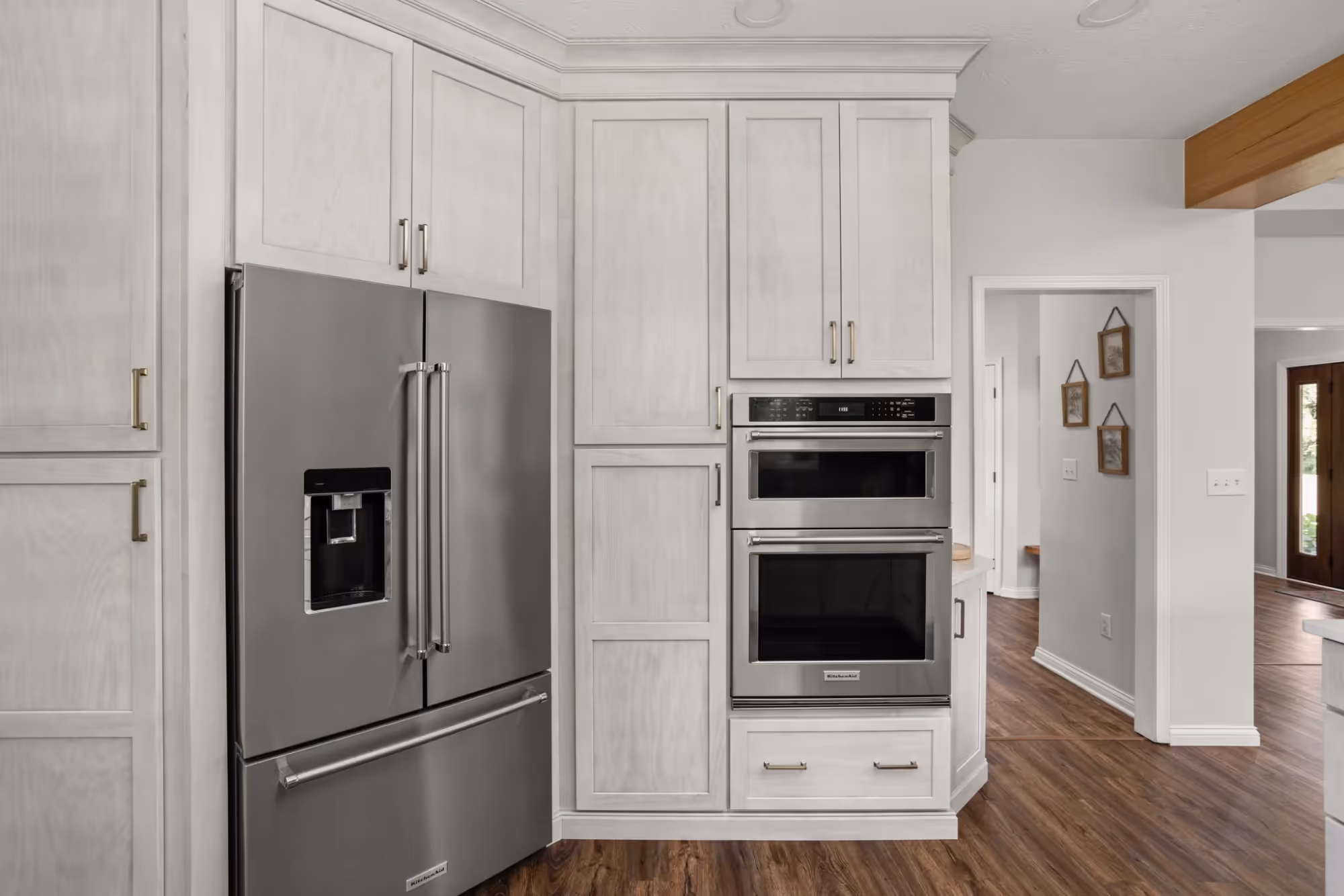 White kitchen with stainless steel appliances
