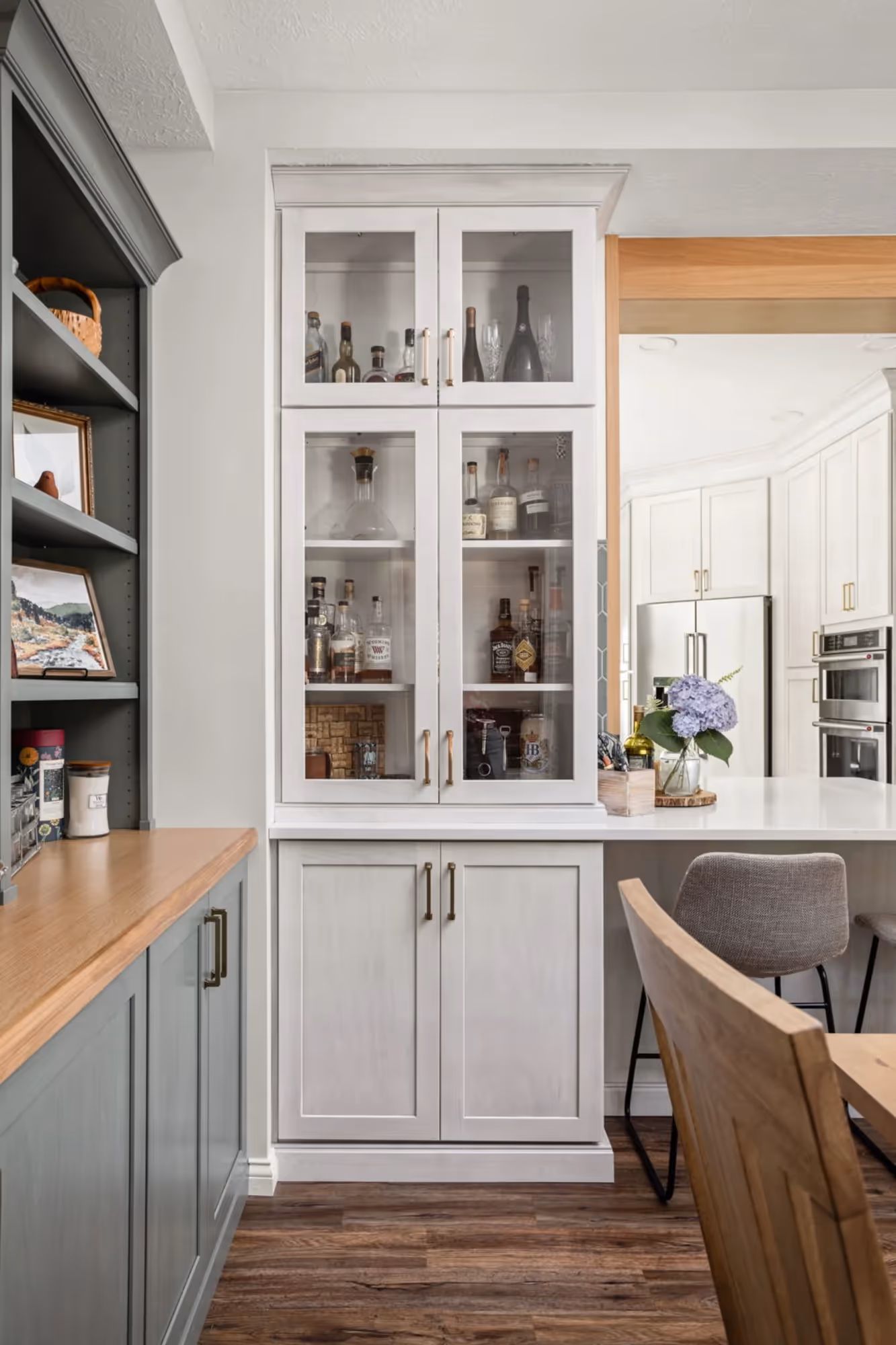 Kitchen with glass-front cabinets and wood countertops