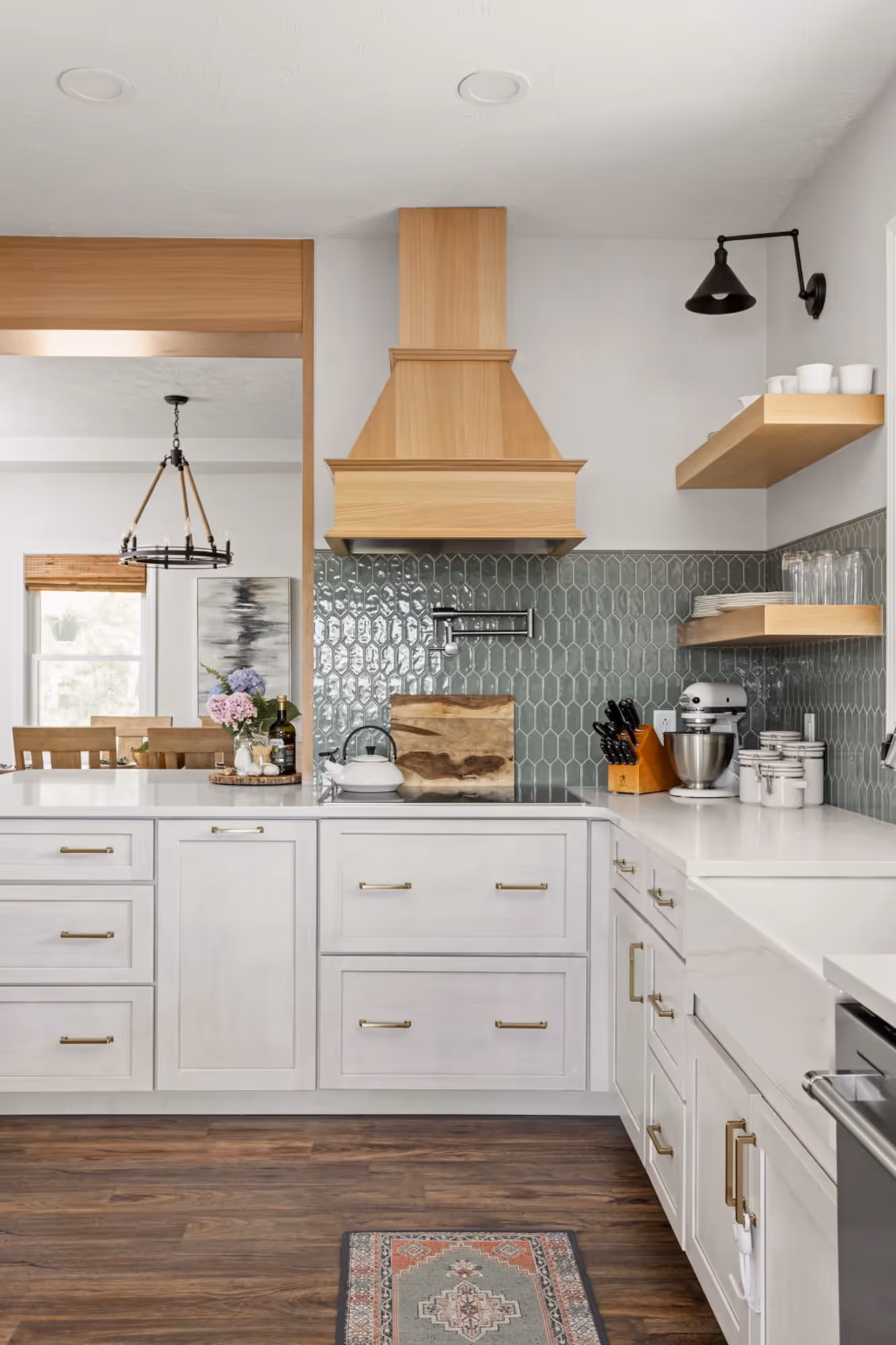 Modern kitchen with white cabinets and stainless steel appliances