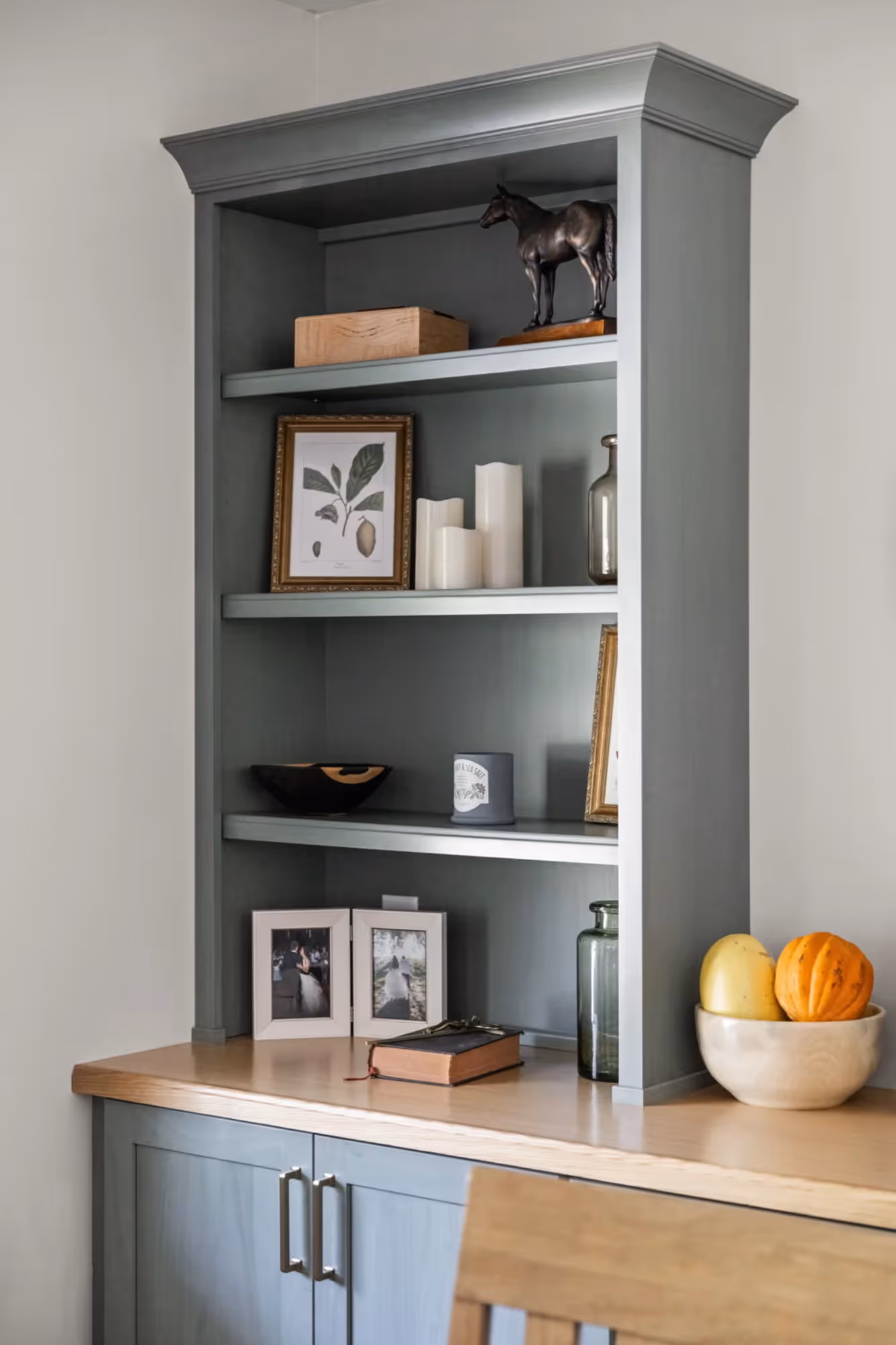 Open shelving nook with microwave and countertop decor