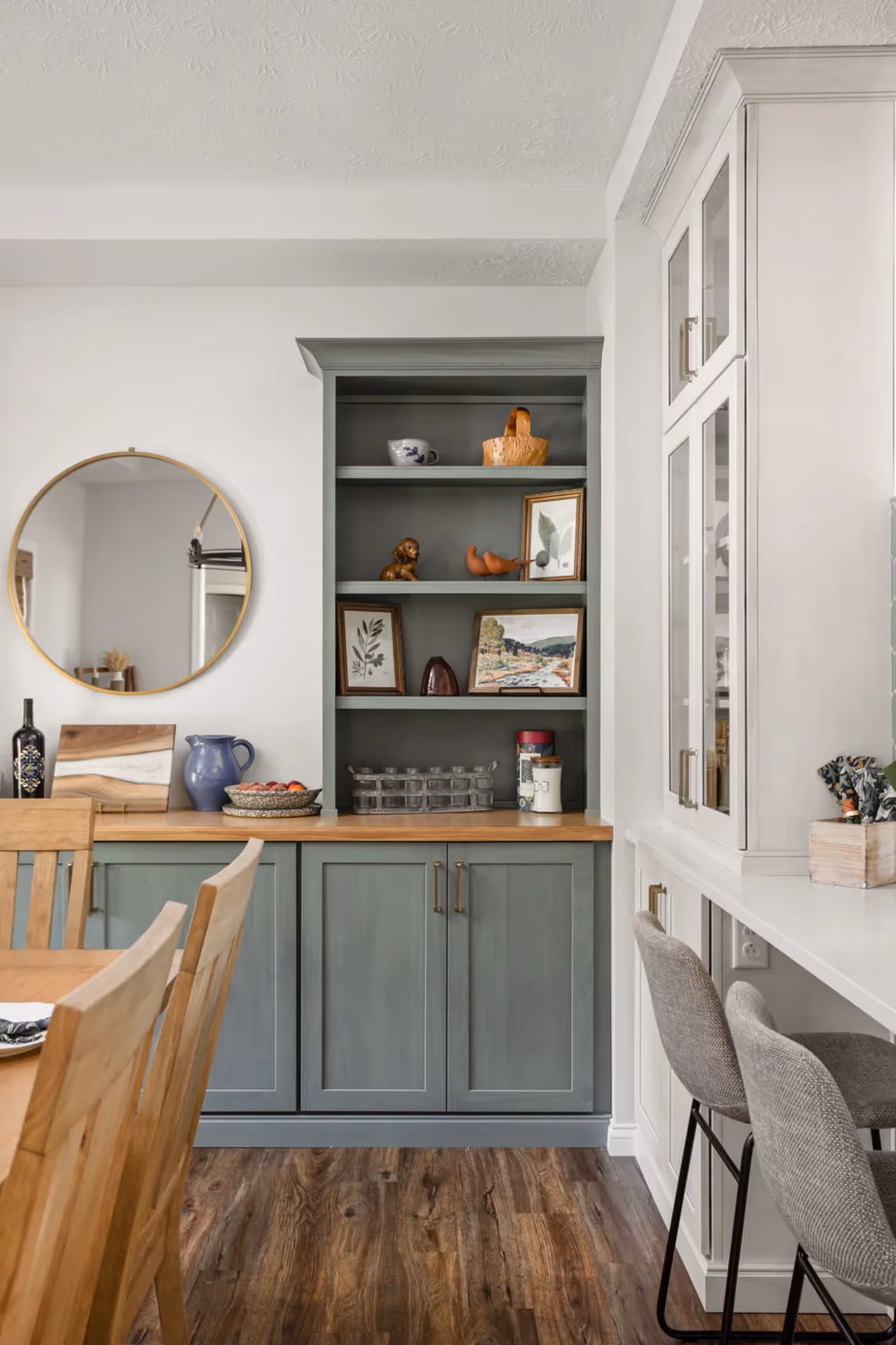Kitchen view into dining area with wooden table