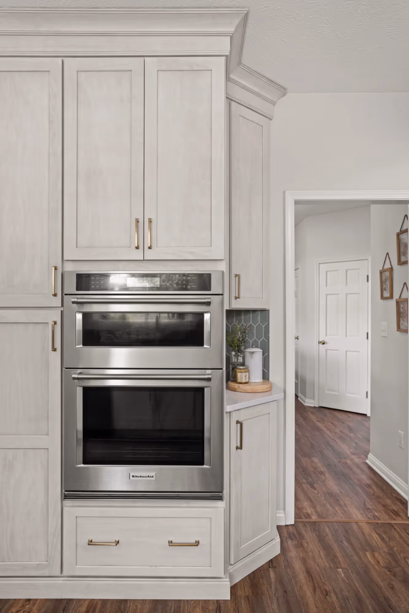 Built-in stainless steel double wall ovens in white cabinetry