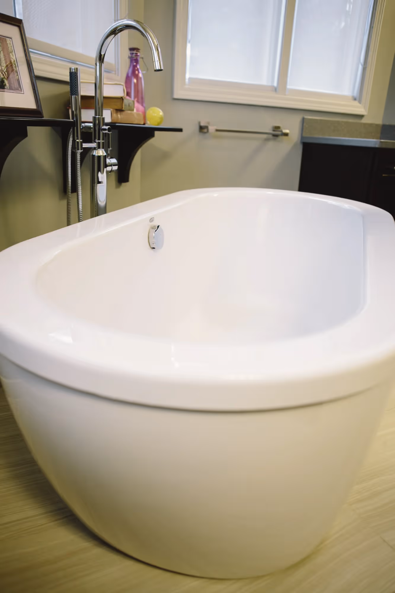 White bathtub in a tiled bathroom