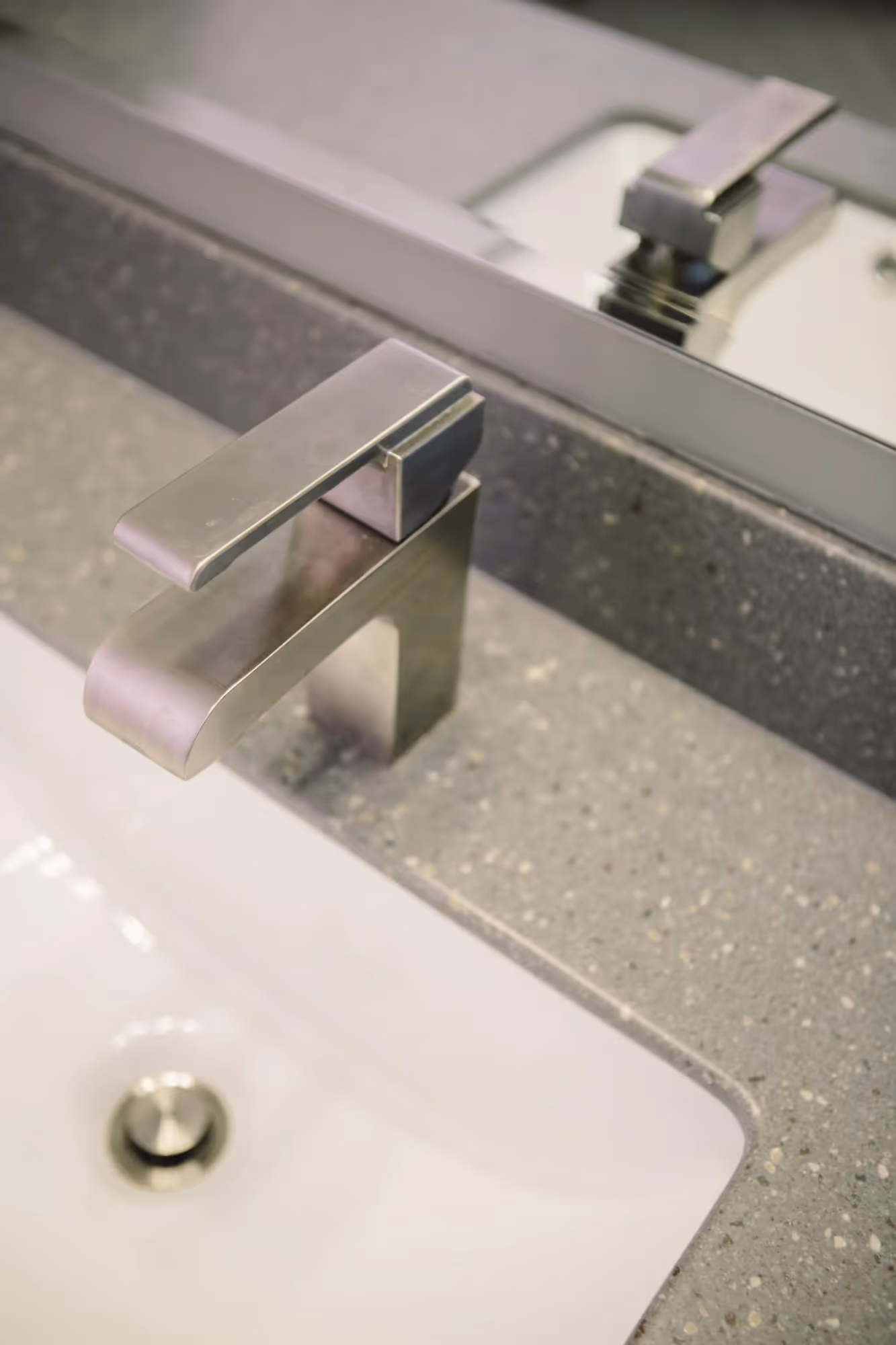 Bathroom sink with countertop and mirror