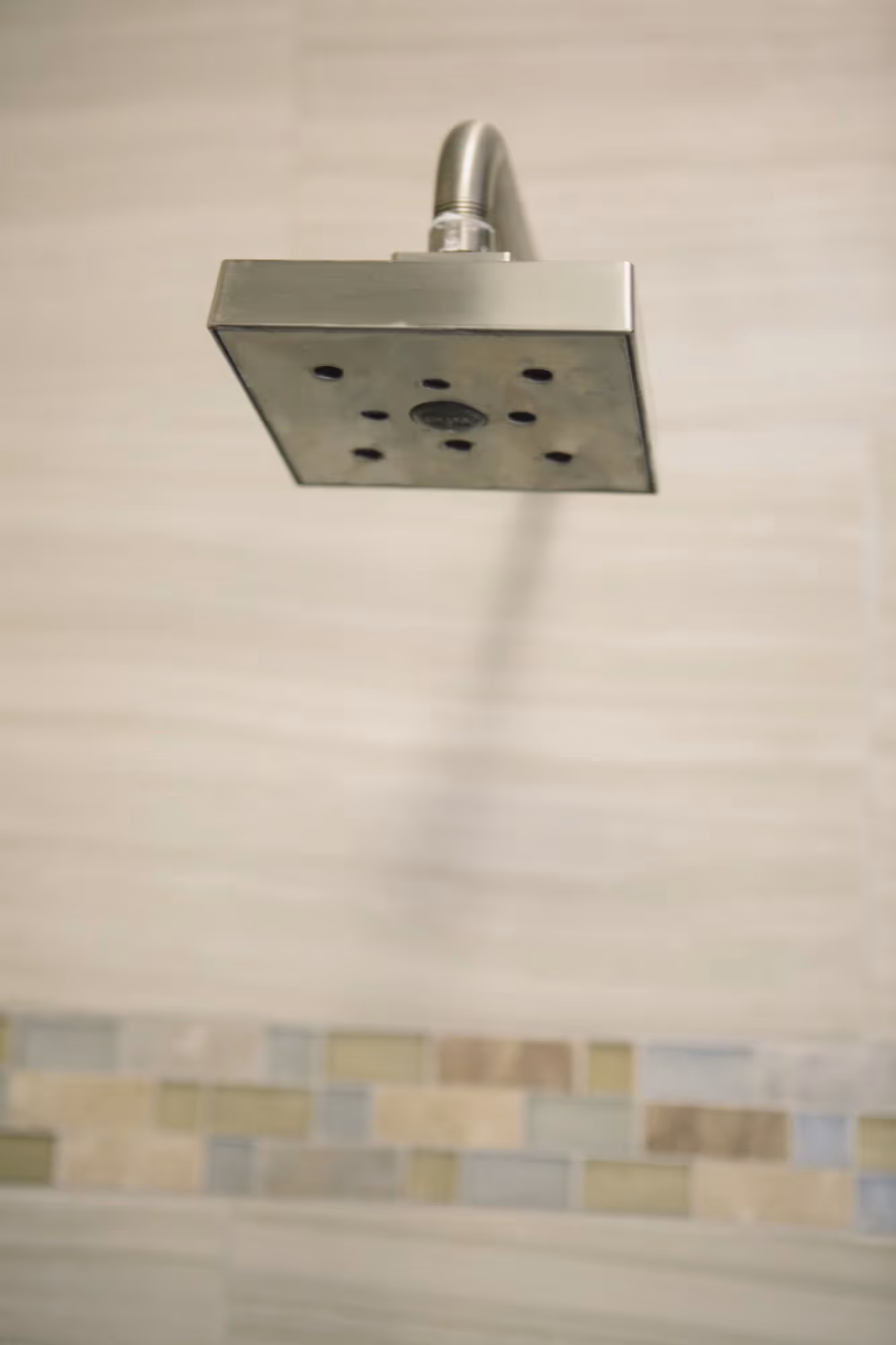 Small bathroom with a wall-mounted sink and mirror.
