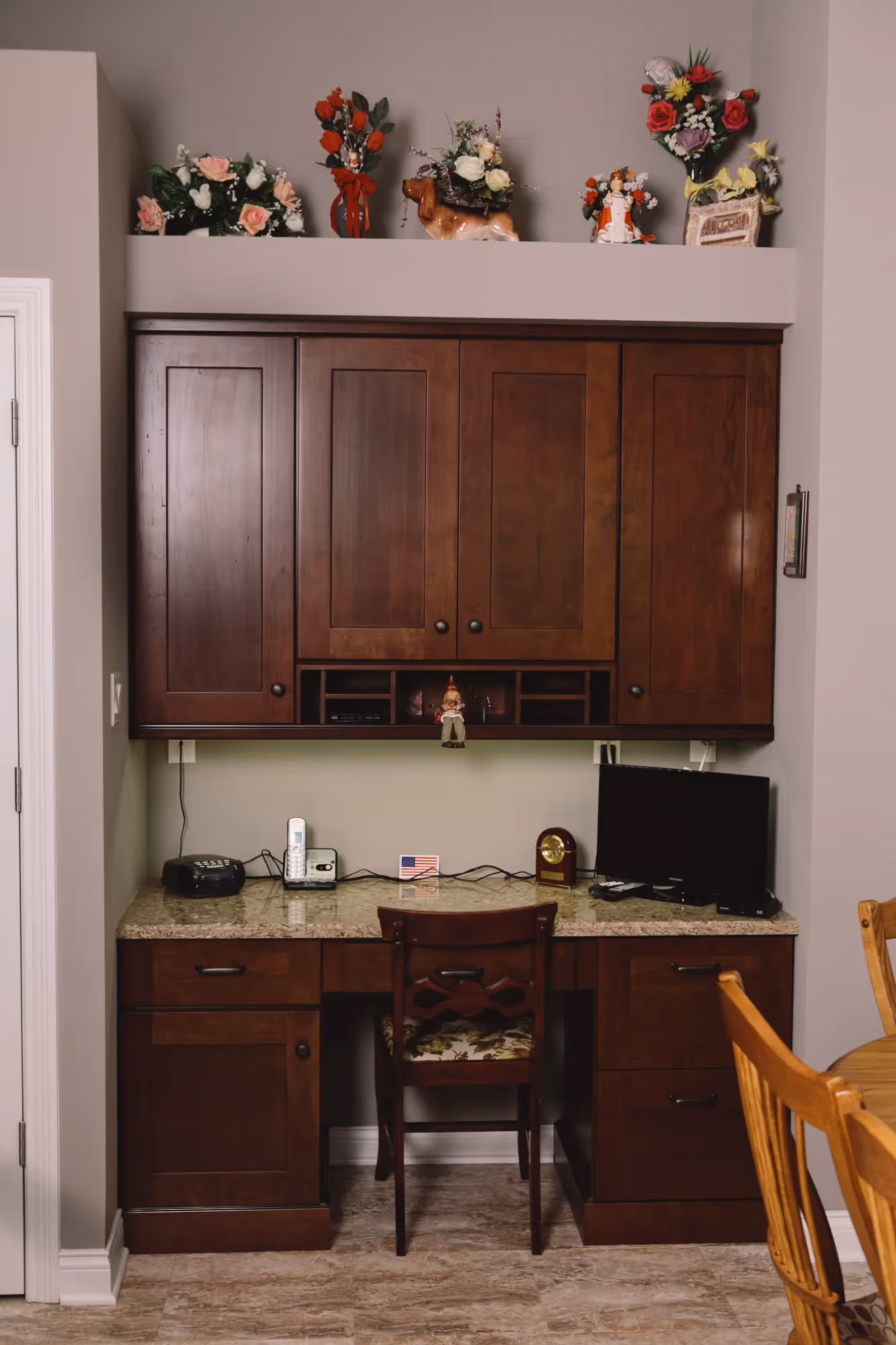 Traditional workspace with wood cabinetry