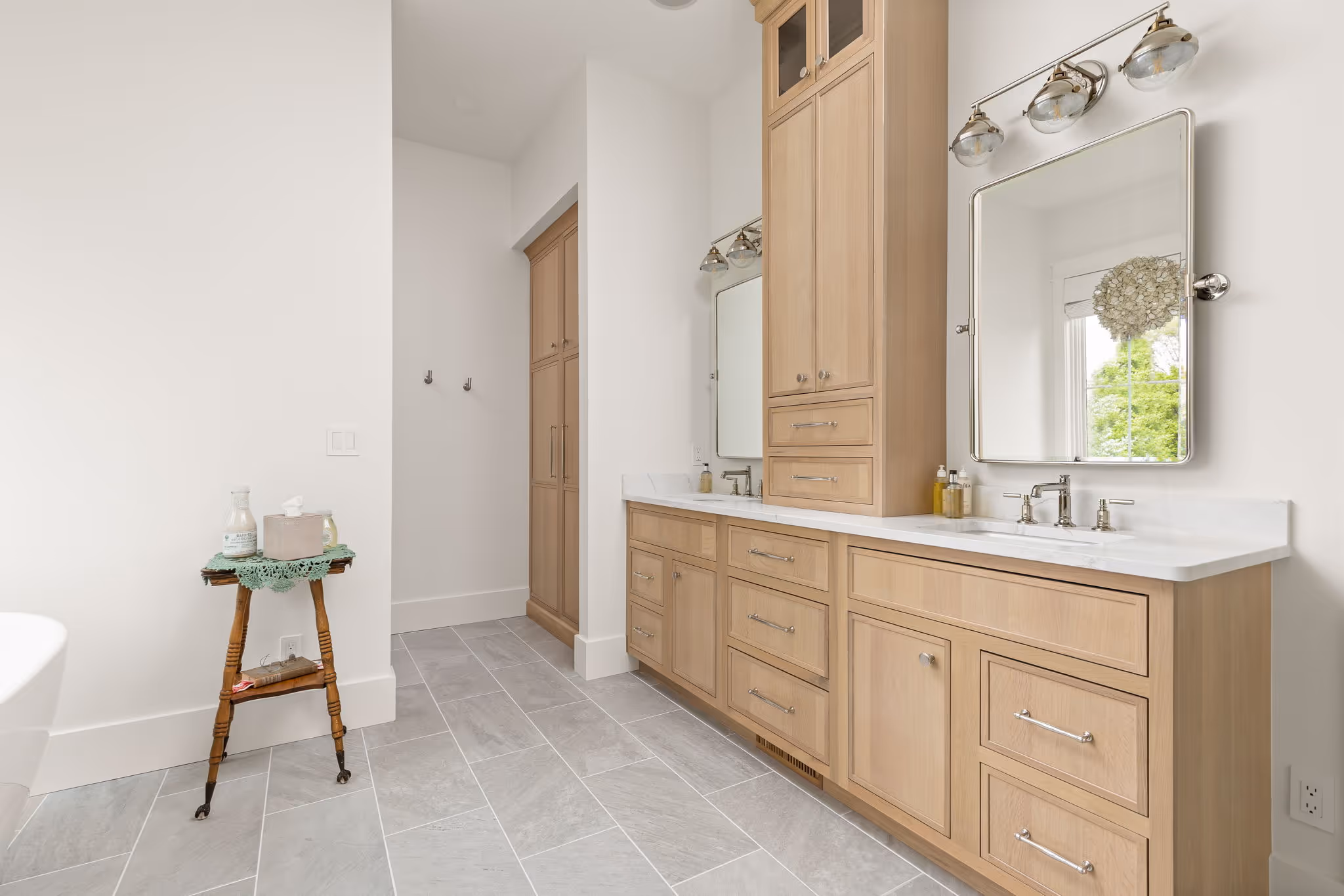 Long bathroom vanity with mirror and stool