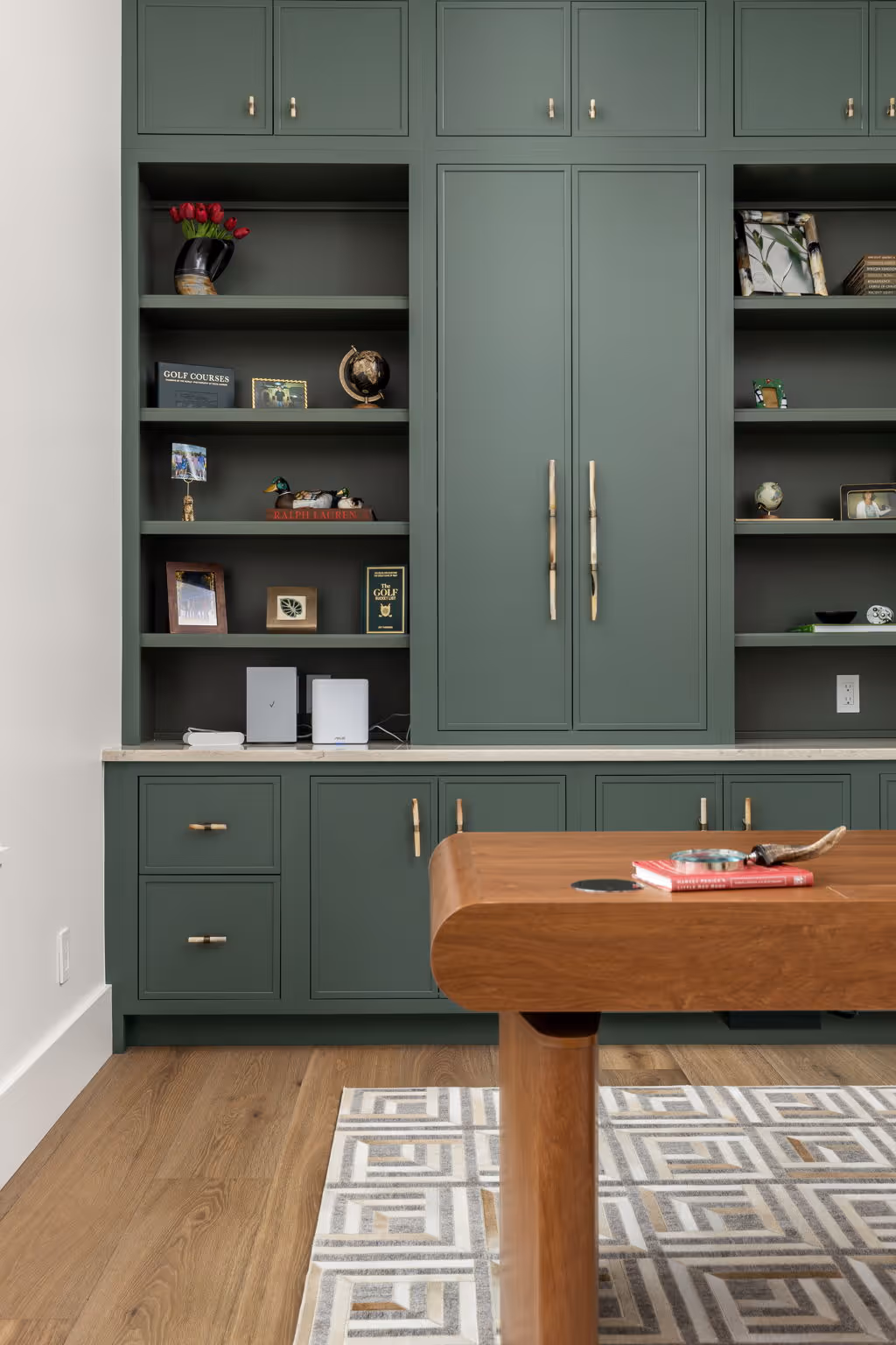 Built-in shelving and cabinetry with dining table