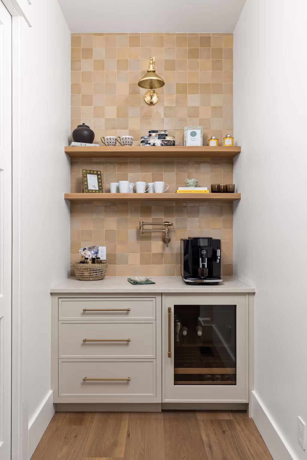 White kitchen with built-in oven, microwave, and range hood