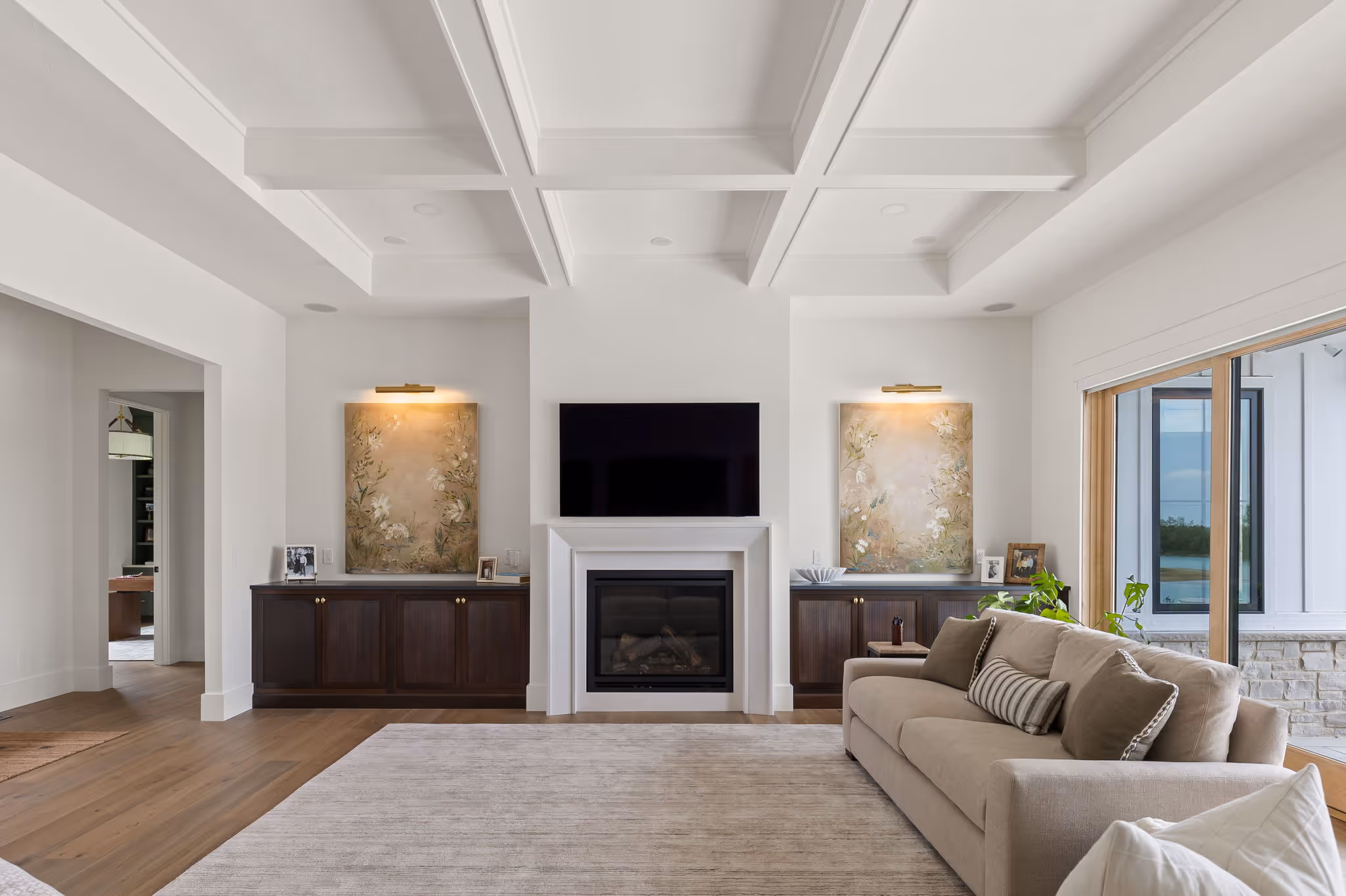 Bright living room with fireplace and built-in shelving
