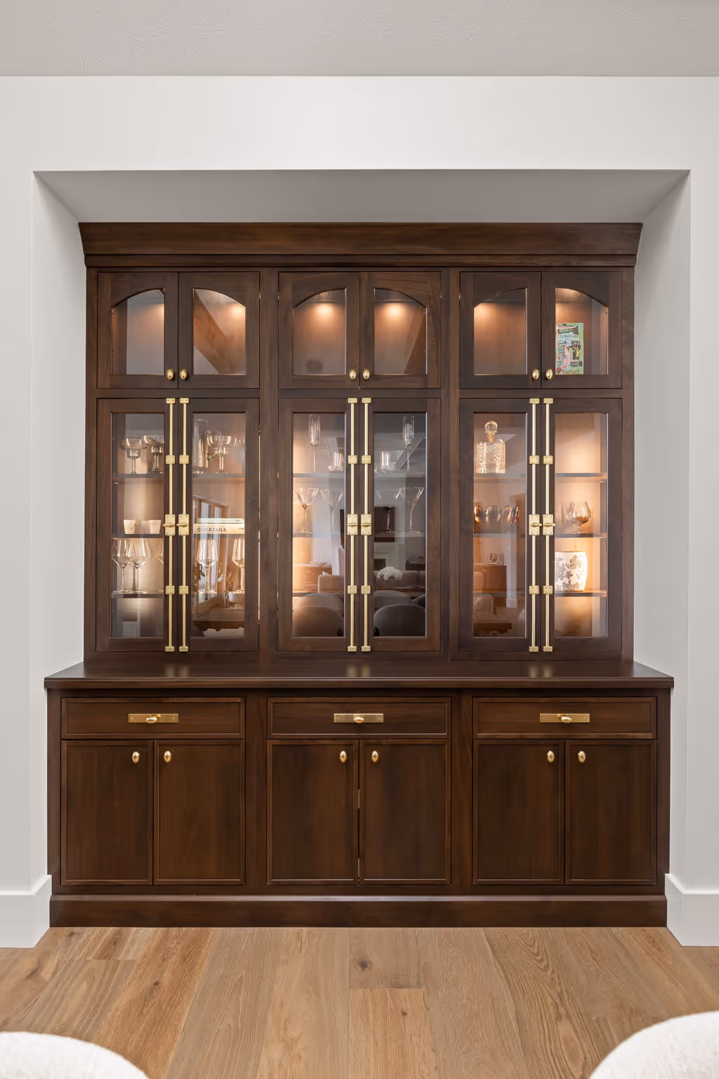 Dark wood illuminated glass display cabinet built-in