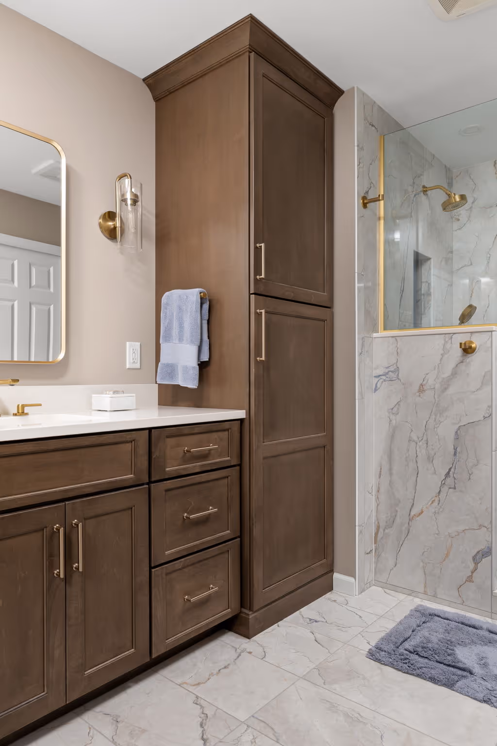 Glass shower and wooden vanity cabinets
