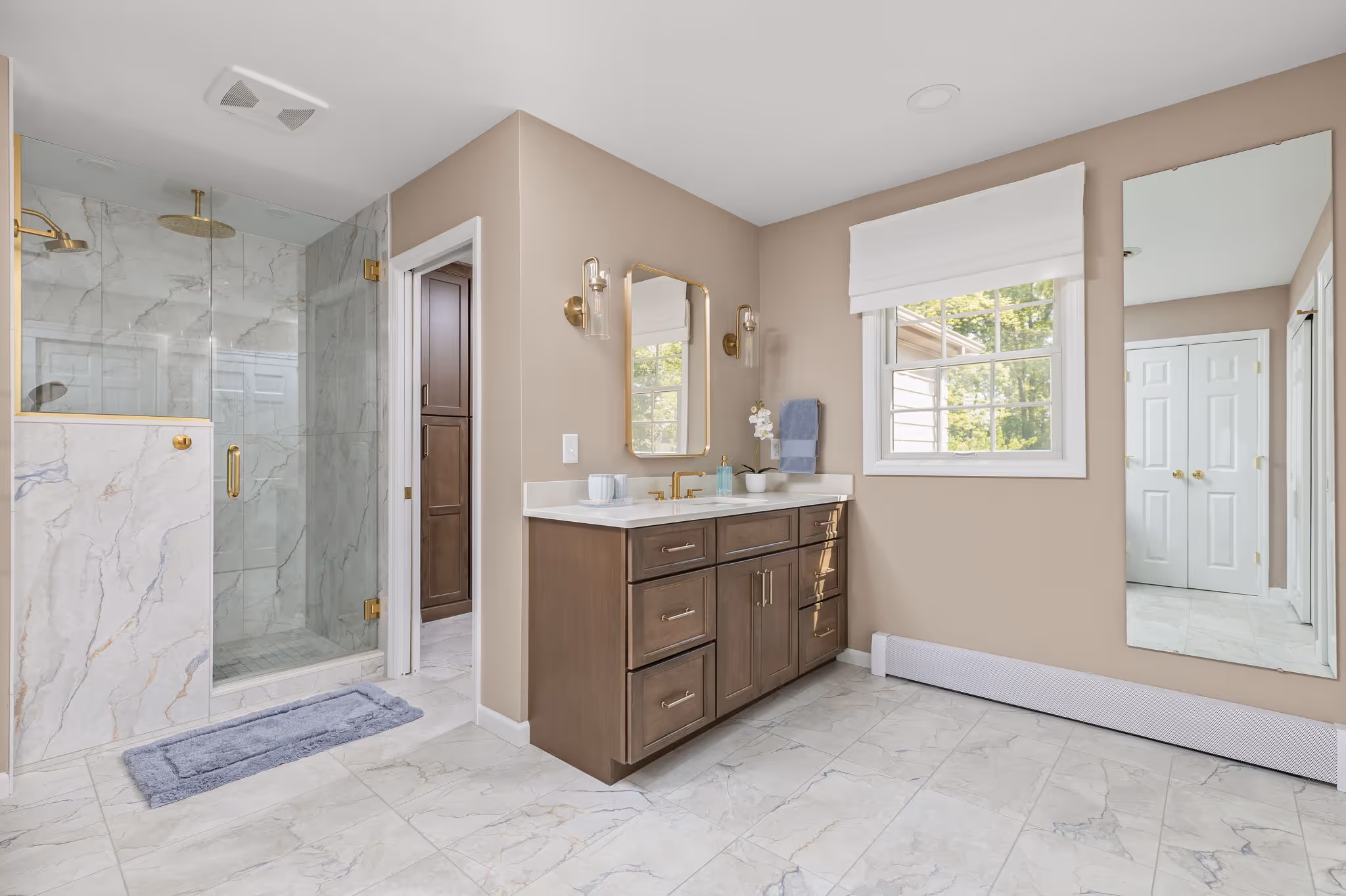 shower wall with brass fixtures