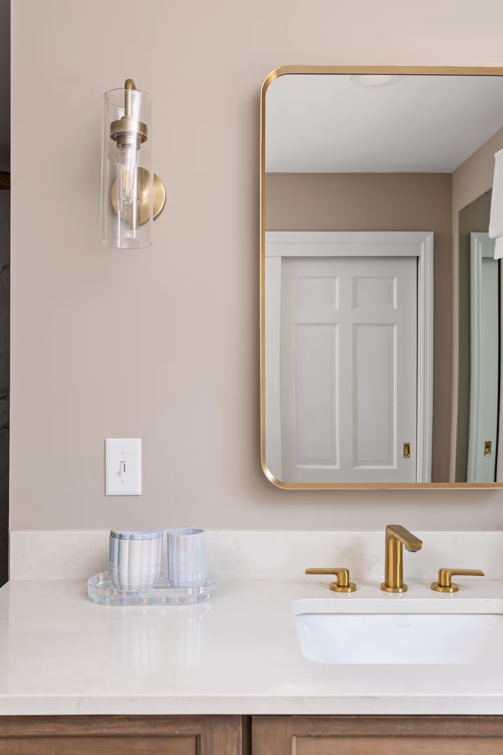 Glass shower and wooden vanity cabinets