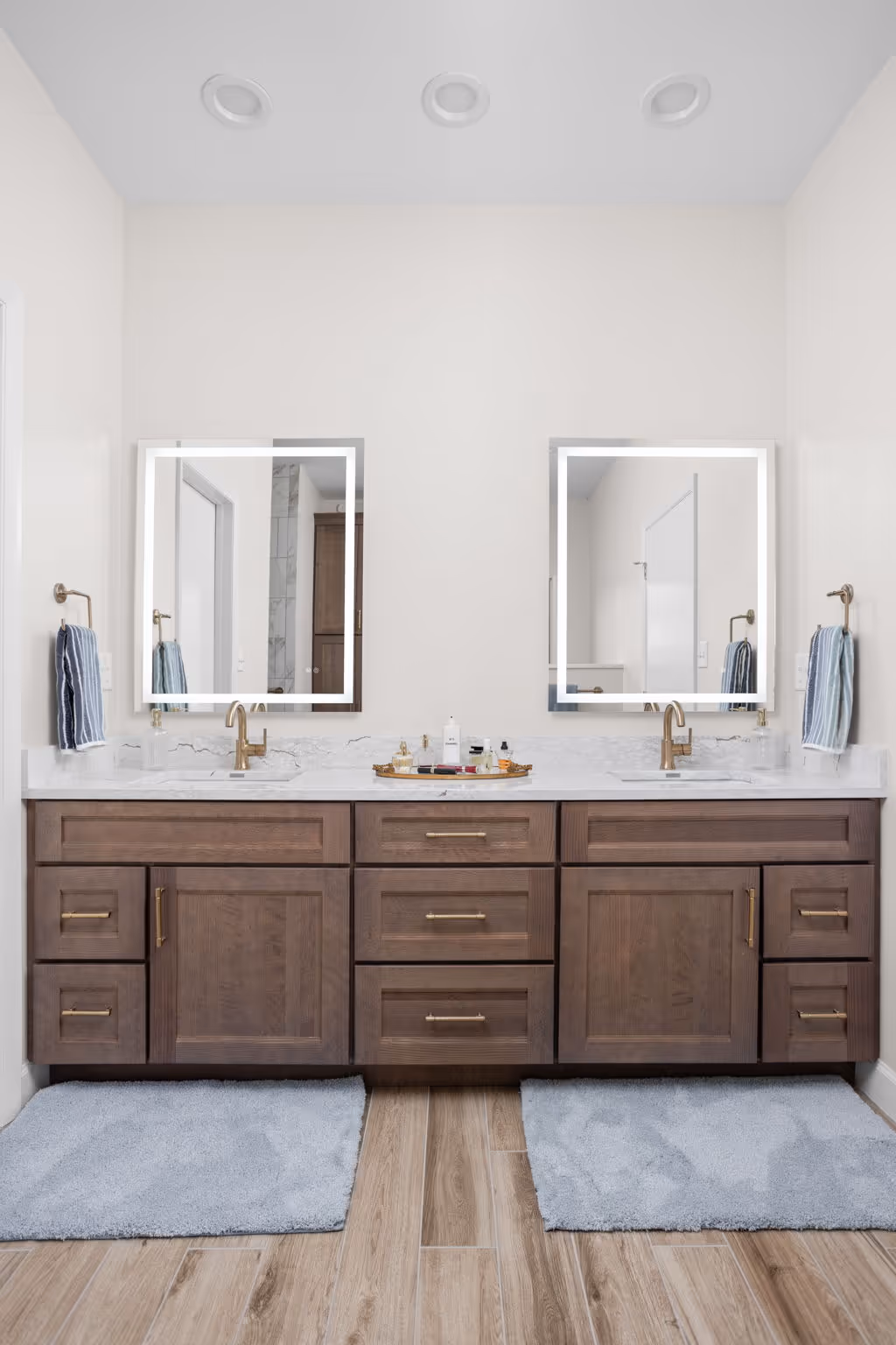 Bathroom vanity with mirror and wood cabinets