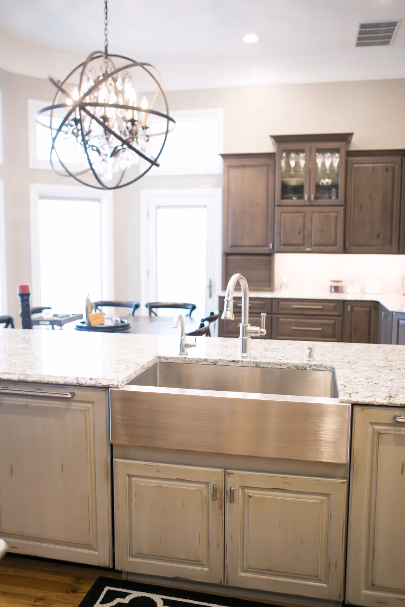 Compact kitchen with wood cabinetry and stone countertops