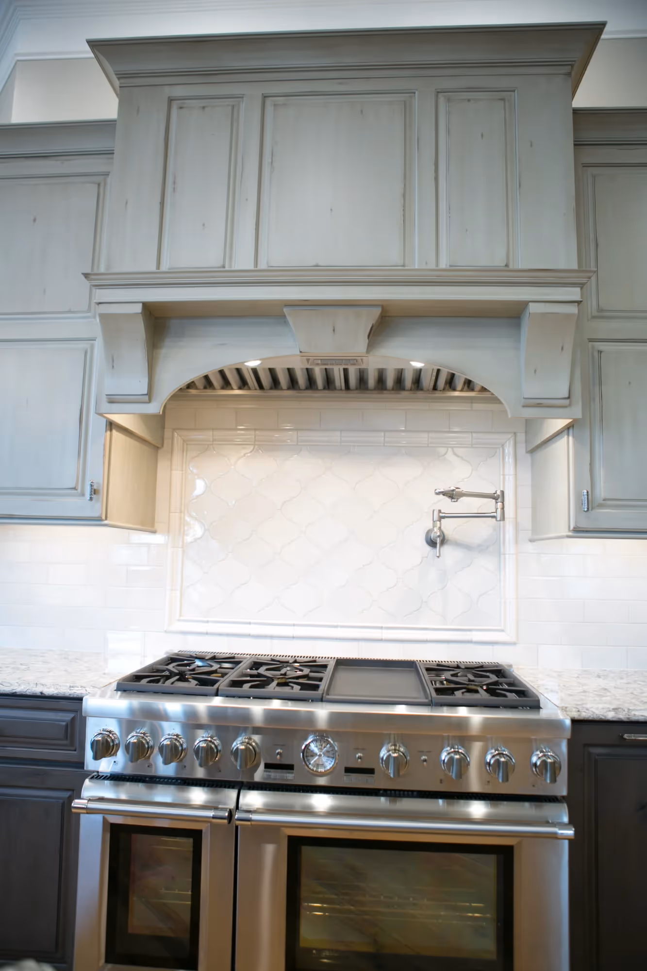 Bright kitchen with cabinetry and stove
