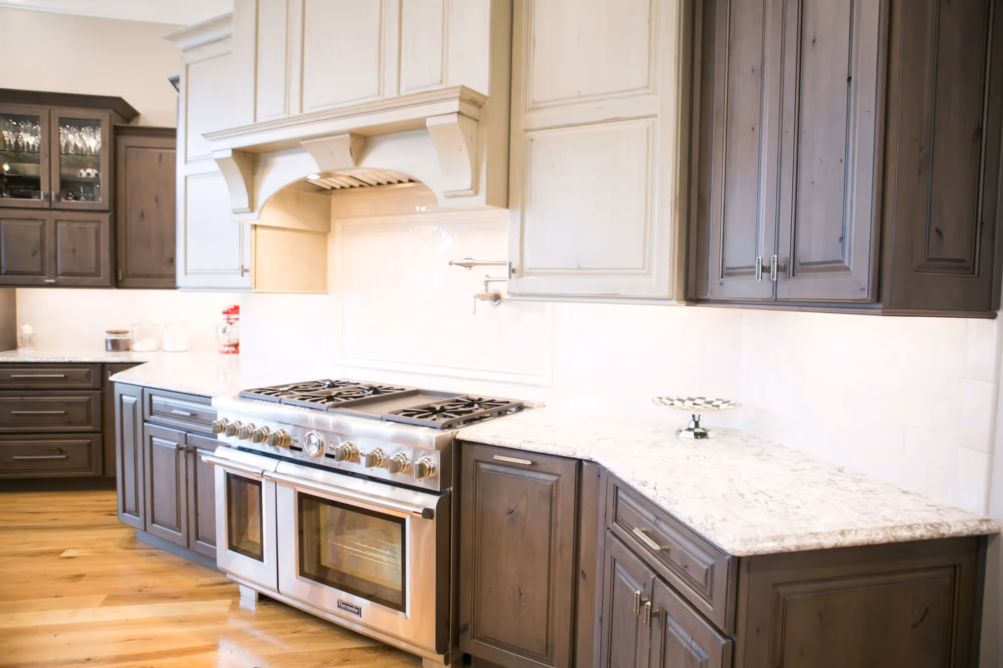 Kitchen island with light countertops and bar seating