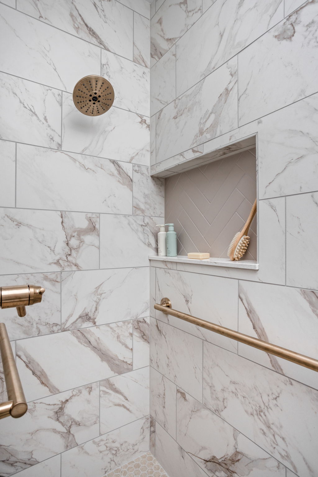 Marble-look backsplash detail with pot filler and faucet