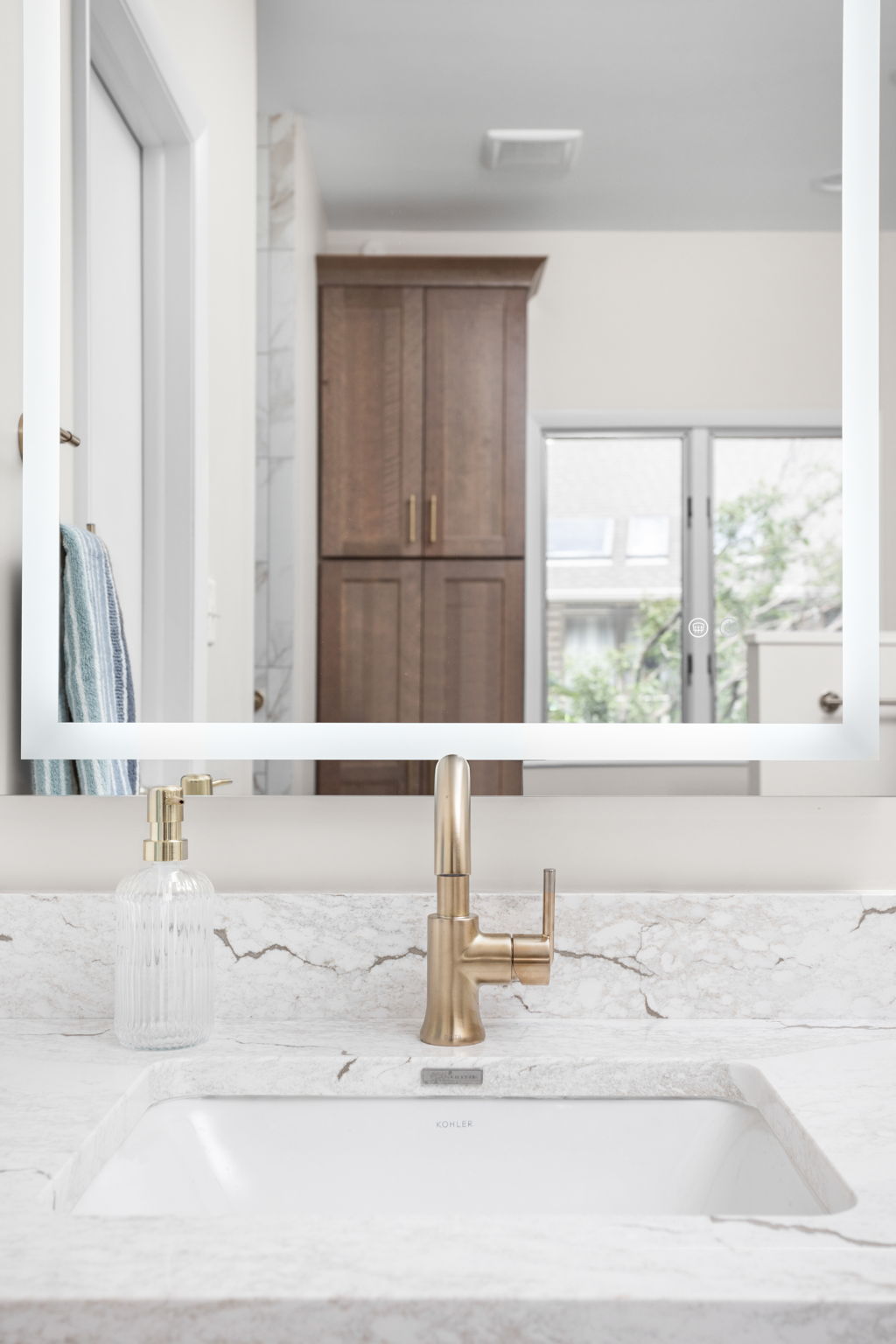 Bathroom shower niche with white tile and chrome fixtures