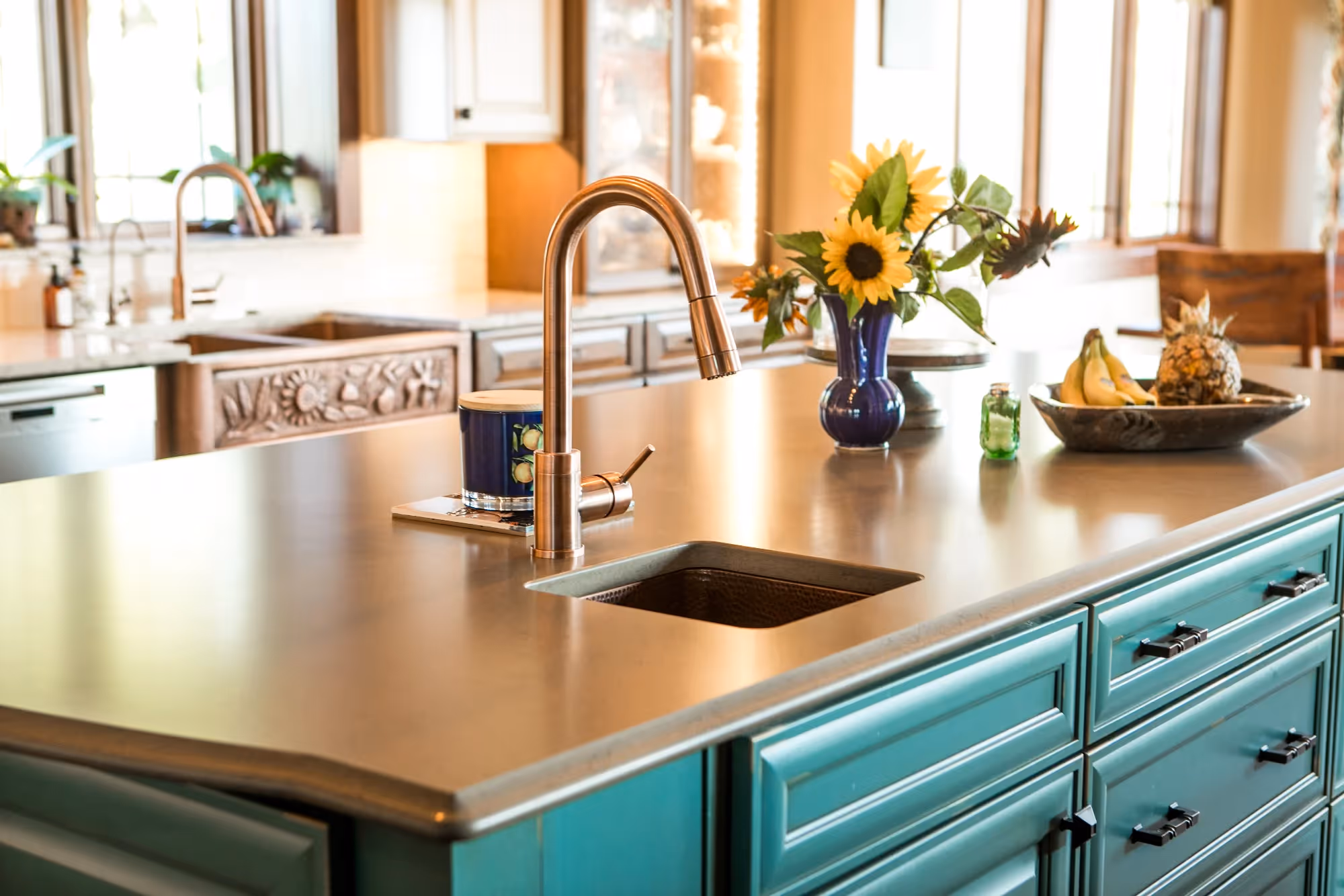 Kitchen with turquoise cabinets and marble counter