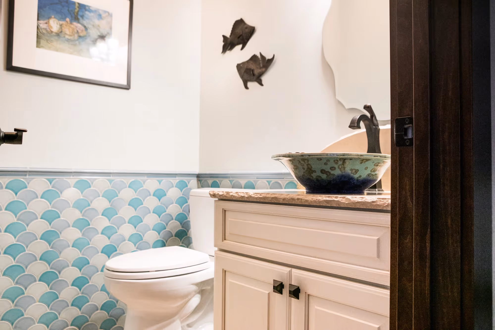 Bathroom vanity with patterned tile backsplash