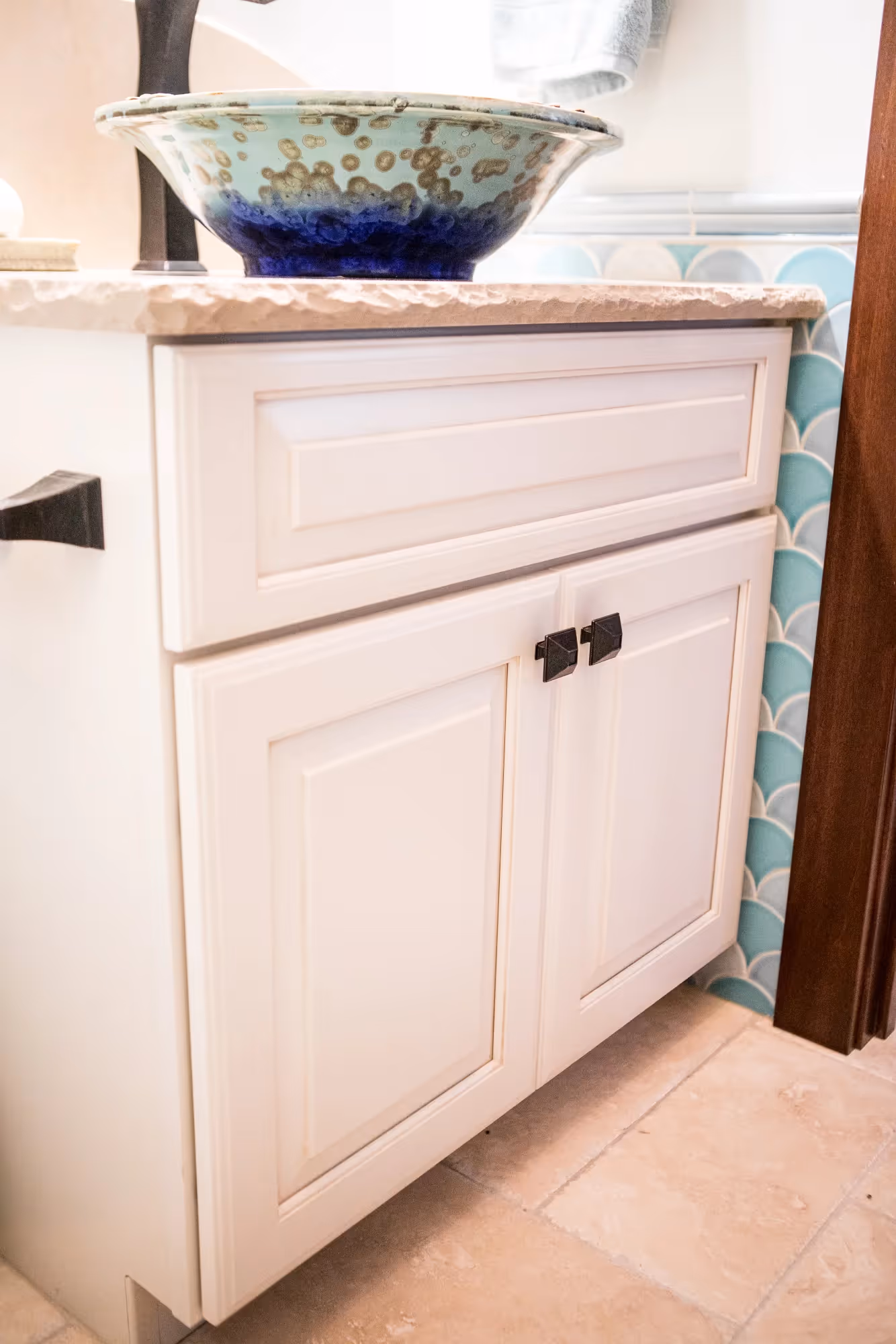 Bathroom vanity with white cabinetry and countertop