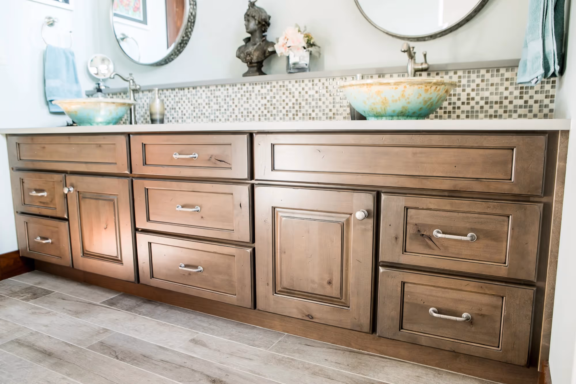 Bathroom vanity with wood cabinetry and double sinks