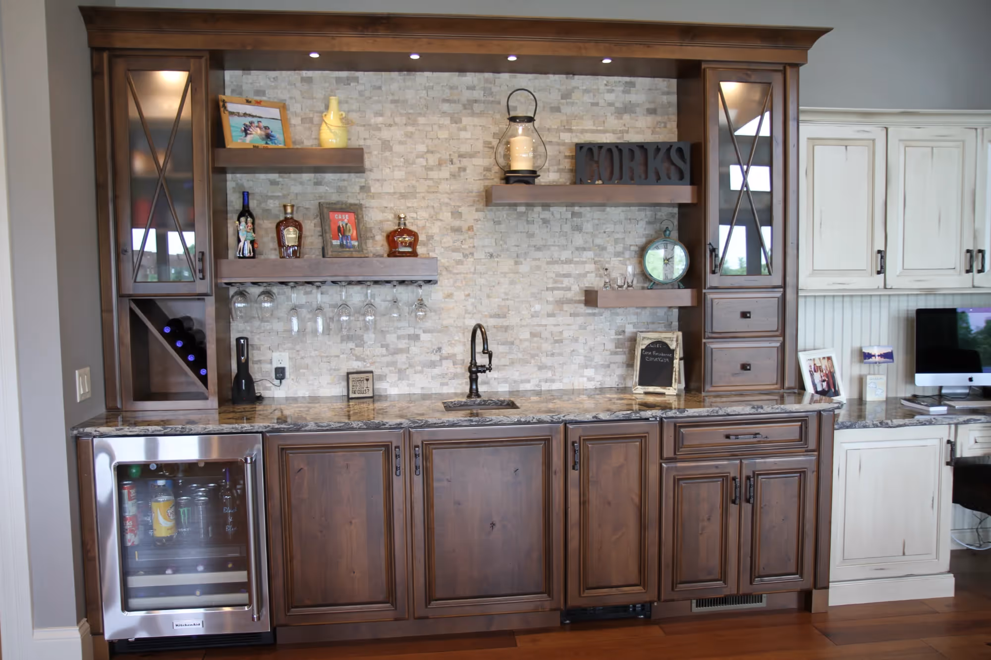Living room with built-in wooden shelves and a TV unit.