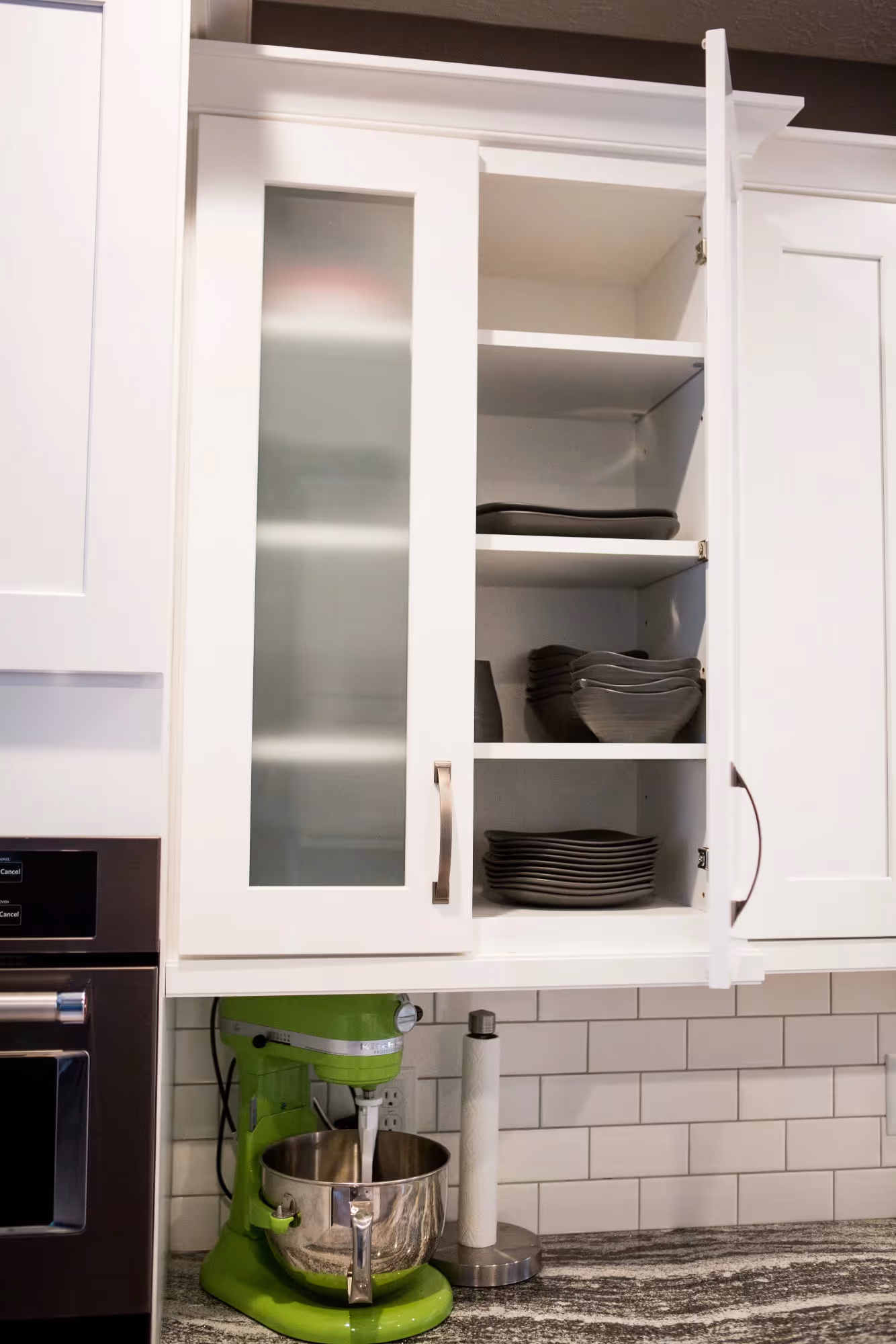Kitchen window above sink with cabinets