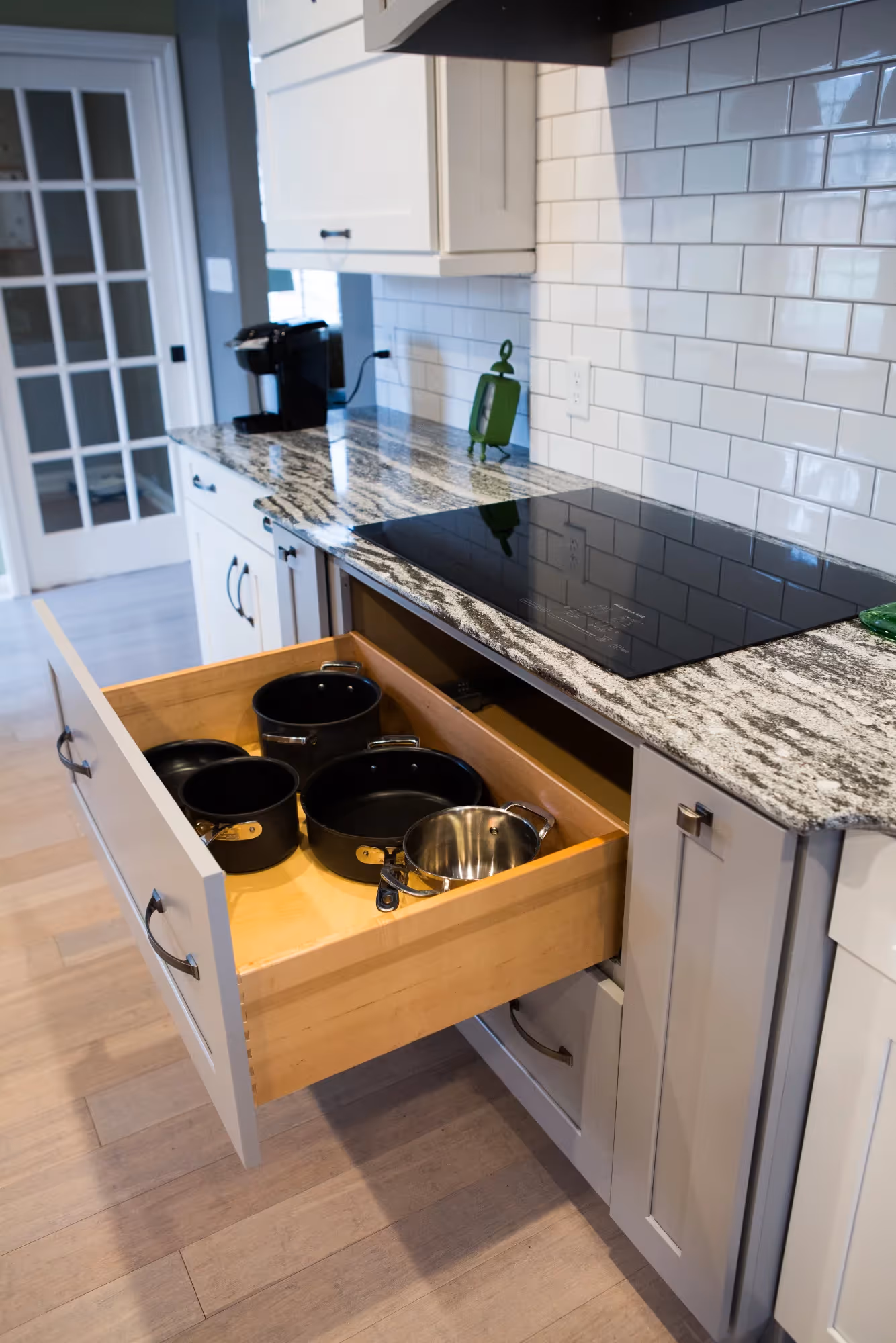 Pull-out drawer with bins in kitchen island